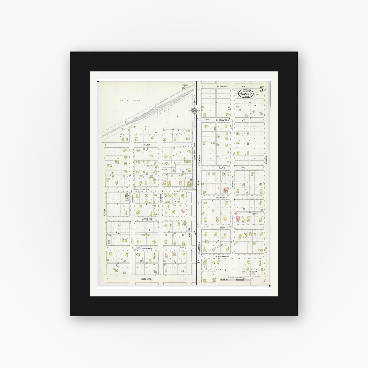 Old map wall art mockup — black gallery frame with white mat — Sanborn Fire Insurance Map from Madelia, Watonwan County, Minnesota (1914), Sheet #0005