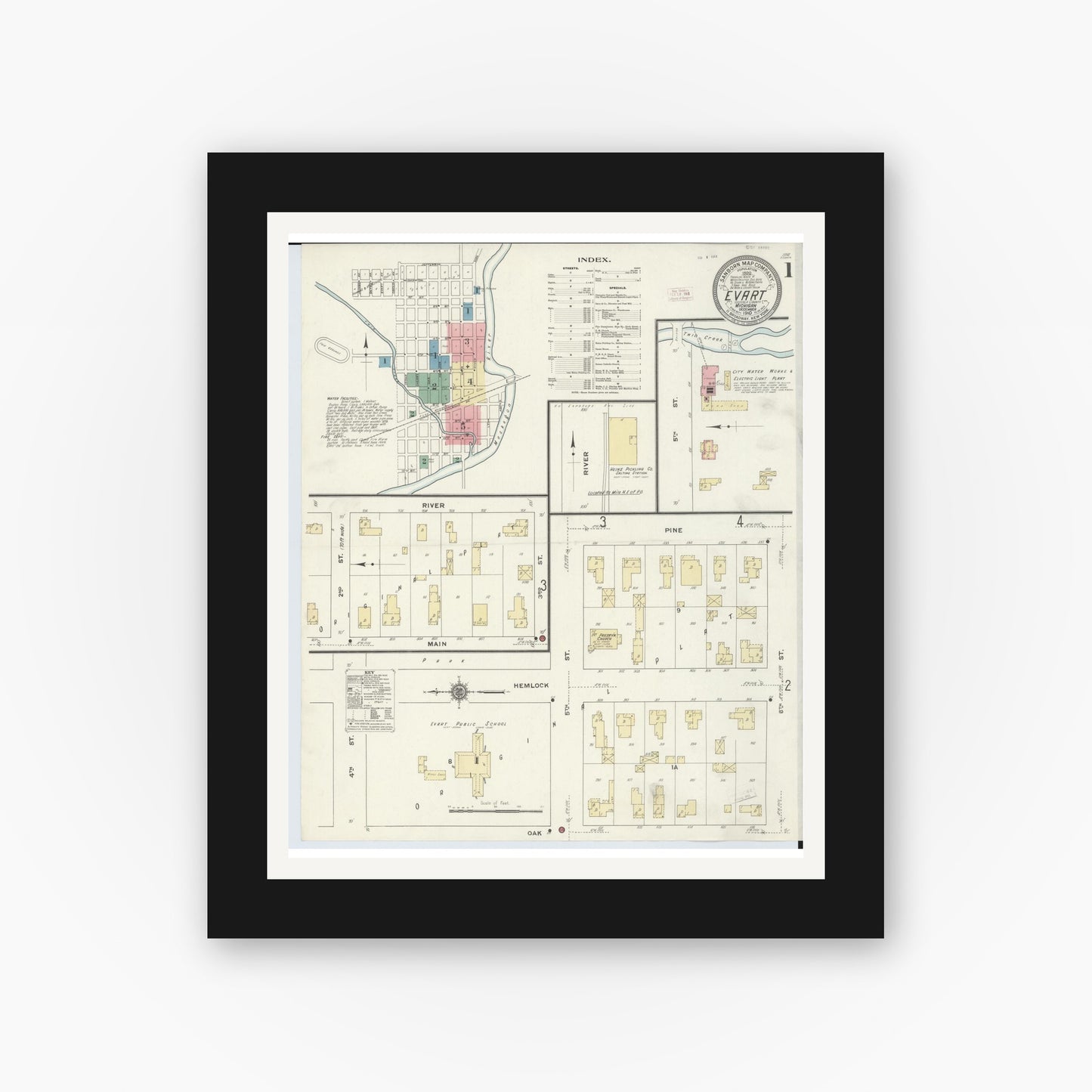 Old map wall art mockup — black gallery frame with white mat — Sanborn Fire Insurance Map from Evart, Osceola County, Michigan (1910) - Complete Map Set