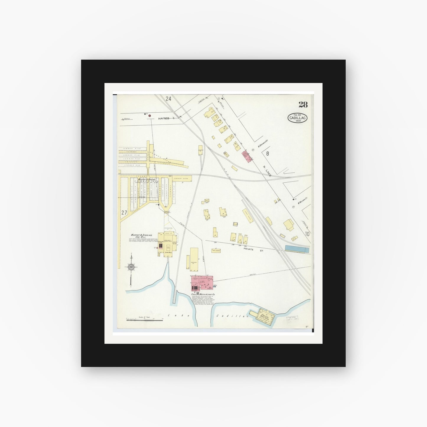 Old map wall art mockup — black gallery frame with white mat — Sanborn Fire Insurance Map from Cadillac, Wexford County, Michigan (1914), Sheet #0028