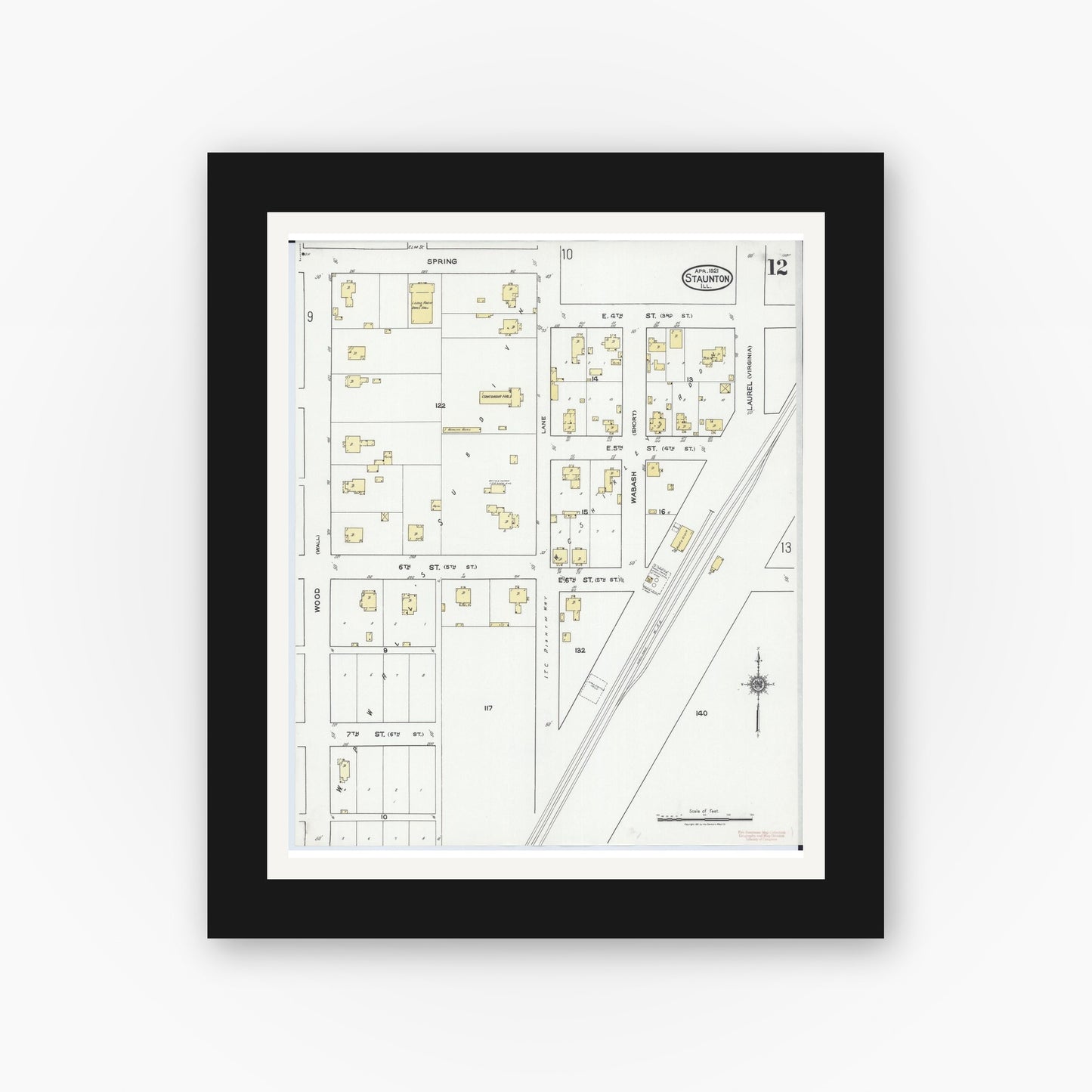 Old map wall art mockup — black gallery frame with white mat — Sanborn Fire Insurance Map from Staunton, Macoupin County, Illinois (1921), Sheet #0012