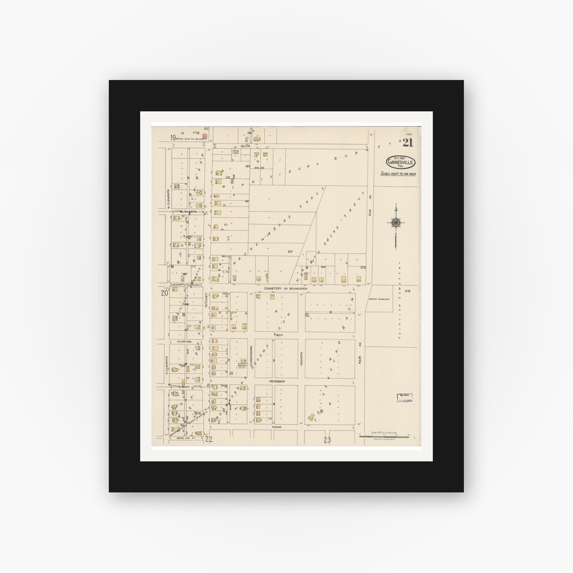 Old map wall art mockup — black gallery frame with white mat — Sanborn Fire Insurance Map from Gainesville, Cooke County, Texas (1922), Sheet #0021