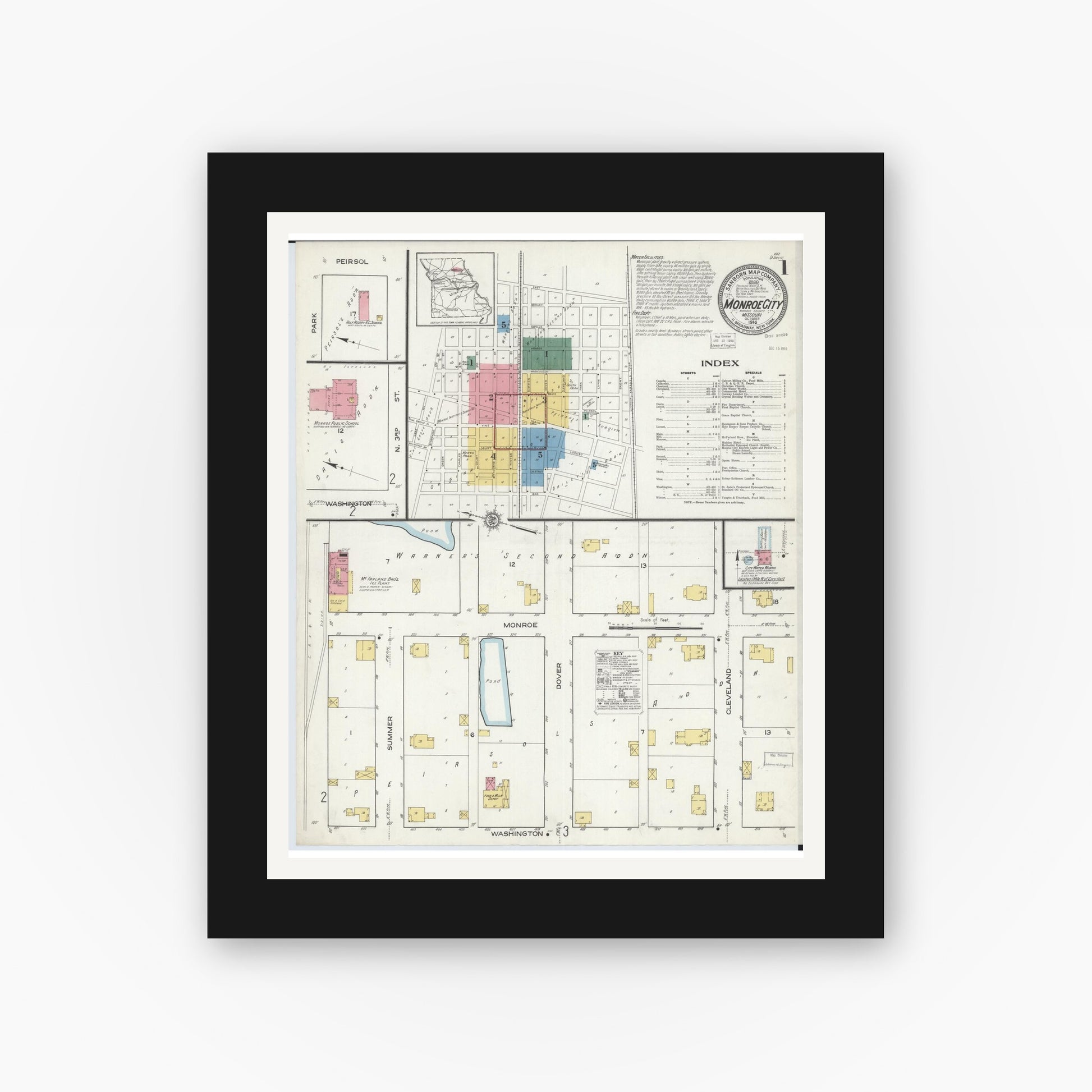 Old map wall art mockup — black gallery frame with white mat — Sanborn Fire Insurance Map from Monroe City, Monroe County, Missouri (1916) - Complete Map Set