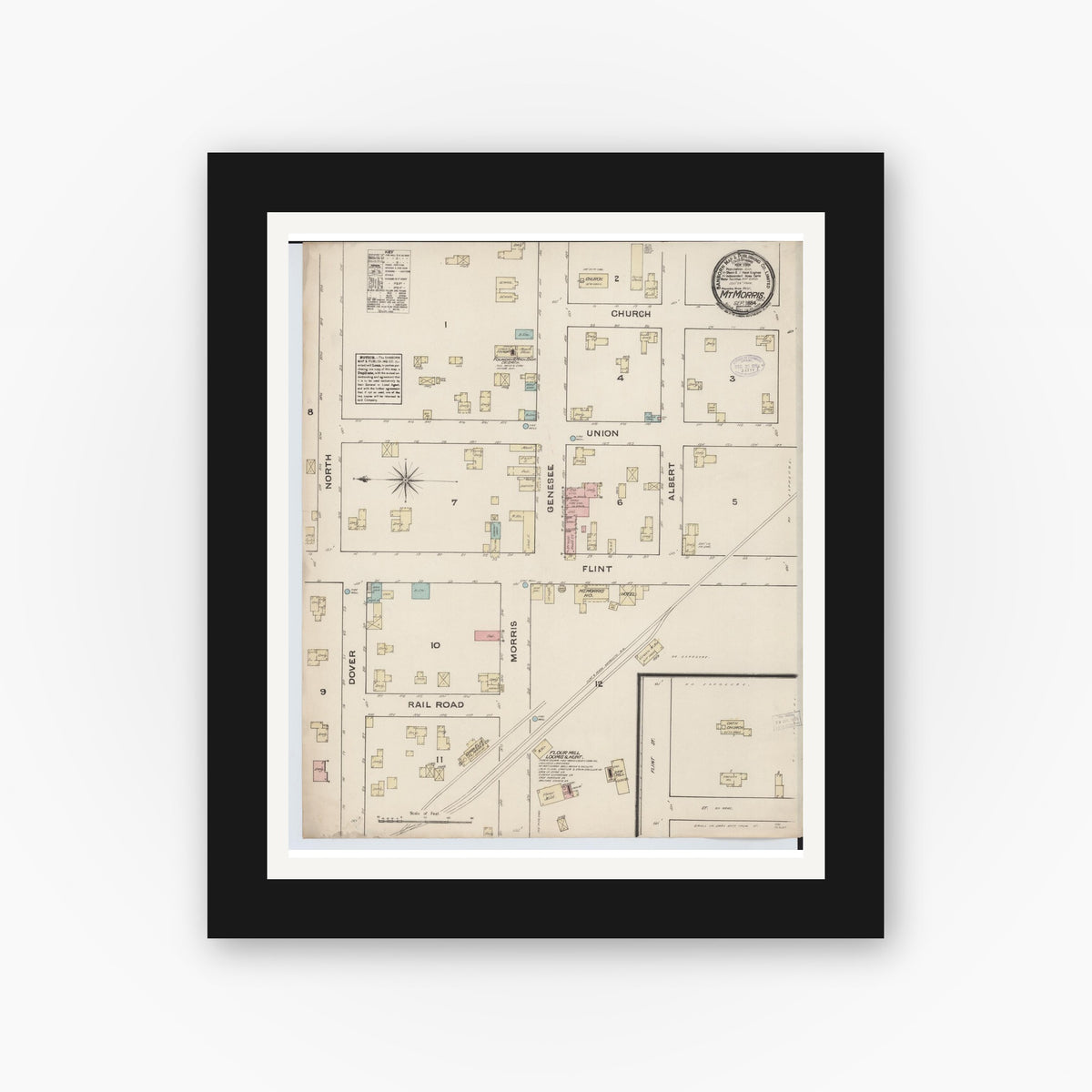 Old map wall art mockup — black gallery frame with white mat — Sanborn Fire Insurance Map from Mount Morris, Genesee County, Michigan (1884), Sheet #0001