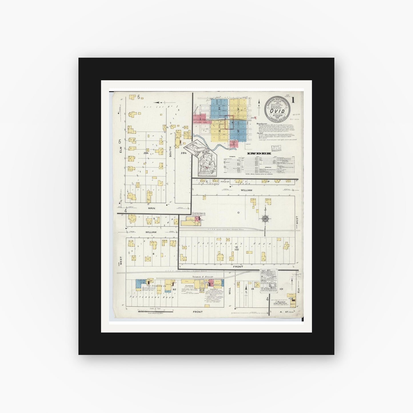 Old map wall art mockup — black gallery frame with white mat — Sanborn Fire Insurance Map from Ovid, Clinton County, Michigan (1918), Sheet #0001