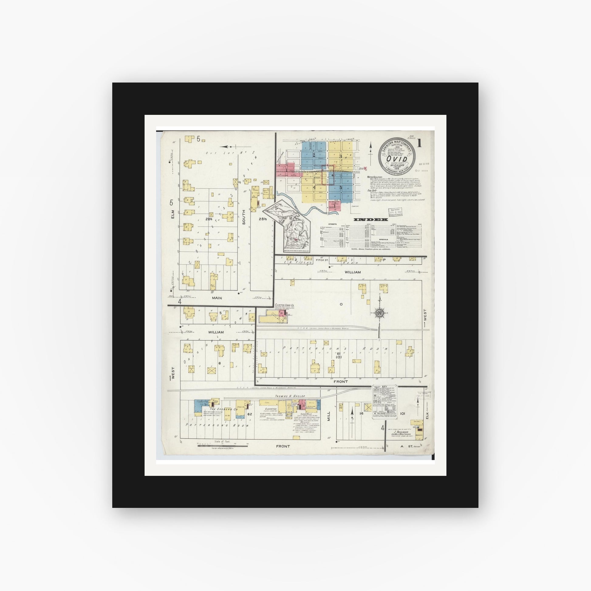 Old map wall art mockup — black gallery frame with white mat — Sanborn Fire Insurance Map from Ovid, Clinton County, Michigan (1918), Sheet #0001