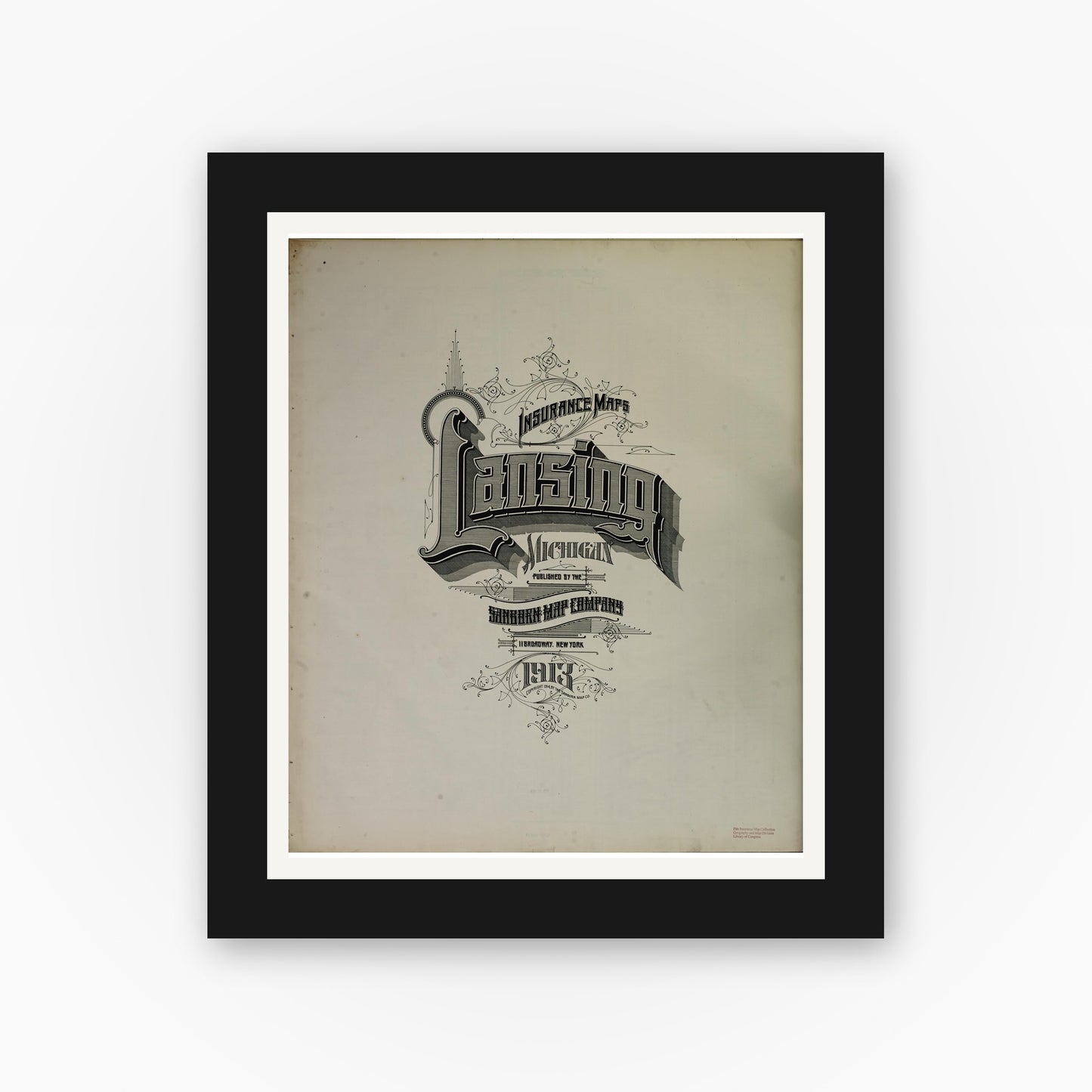 Old map wall art mockup — black gallery frame with white mat — Sanborn Fire Insurance Map from Lansing, Ingham County, Michigan (1913), Sheet #0001