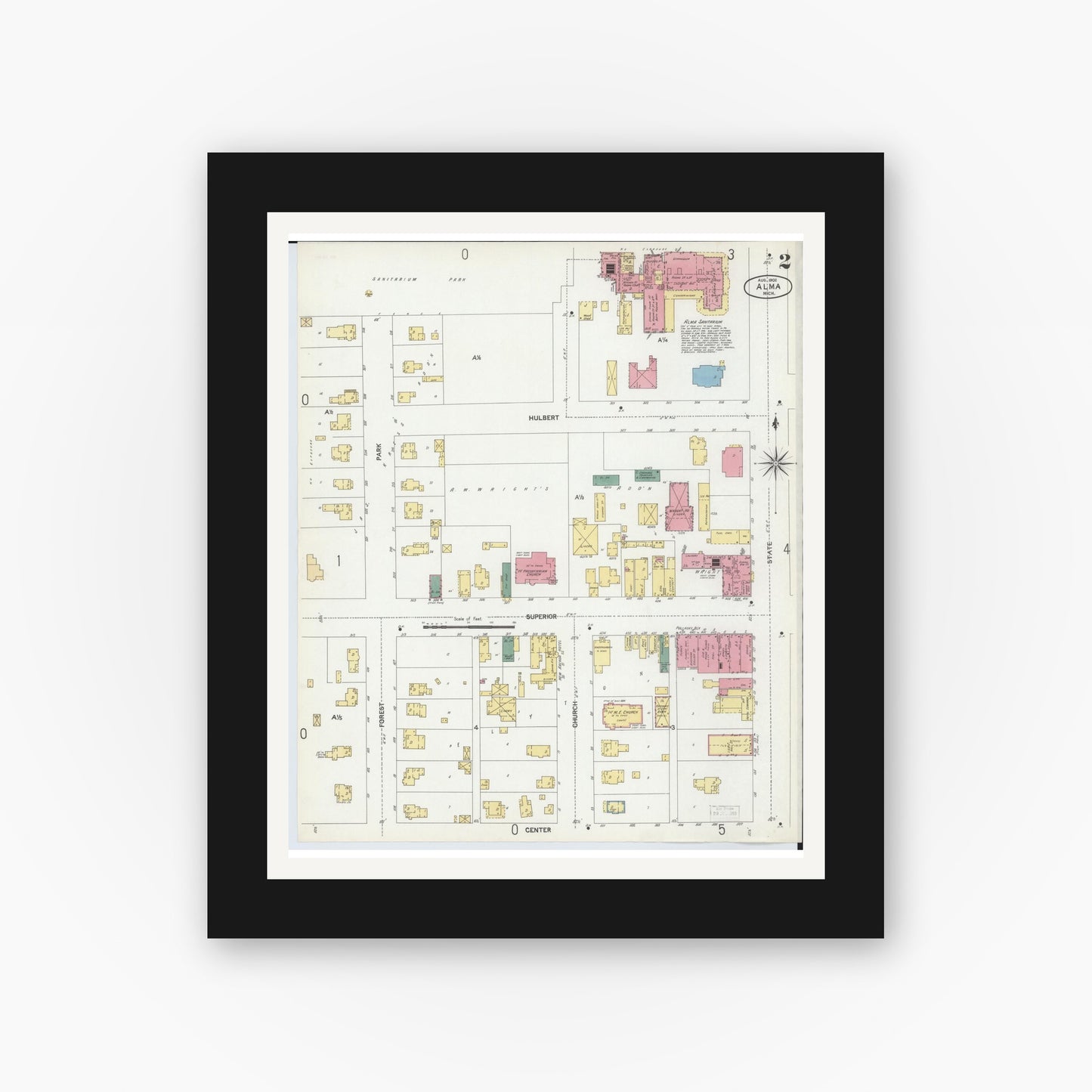 Old map wall art mockup — black gallery frame with white mat — Sanborn Fire Insurance Map from Alma, Gratiot County, Michigan (1902), Sheet #0002