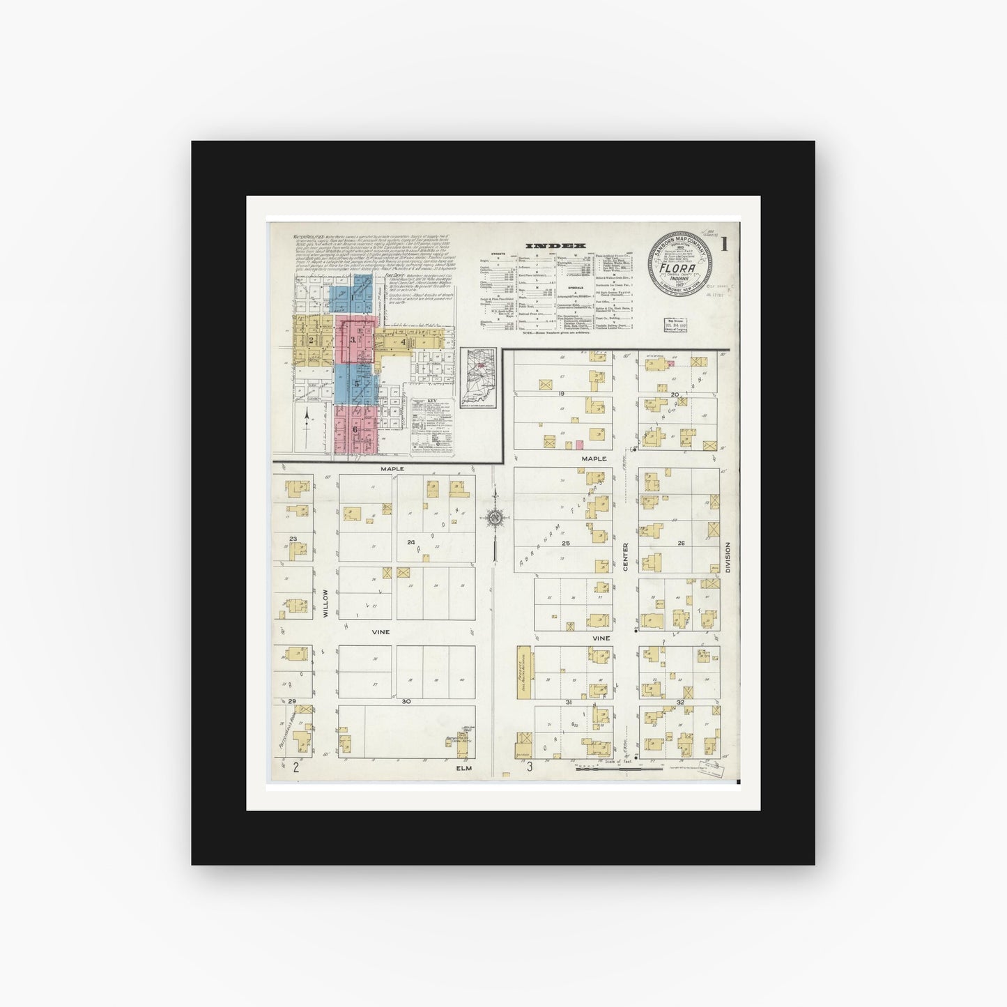 Old map wall art mockup — black gallery frame with white mat — Sanborn Fire Insurance Map from Flora, Carroll County, Indiana (1917), Sheet #0001