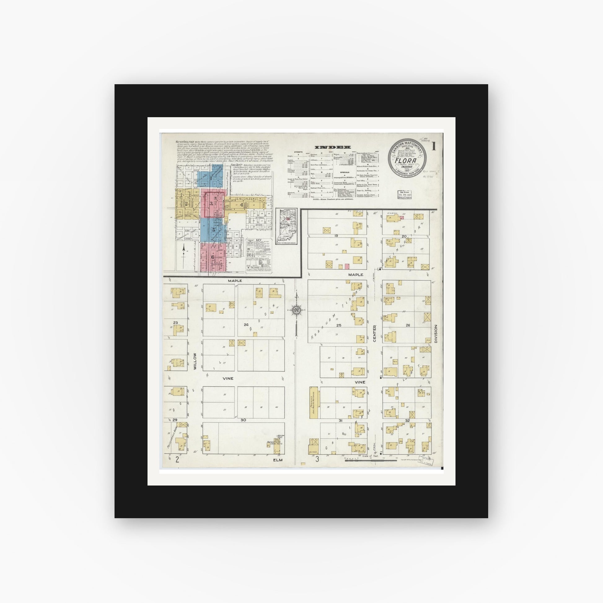 Old map wall art mockup — black gallery frame with white mat — Sanborn Fire Insurance Map from Flora, Carroll County, Indiana (1917), Sheet #0001