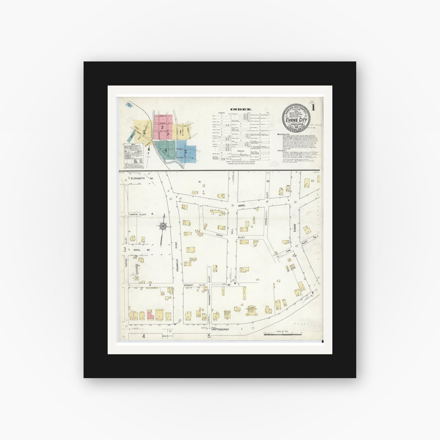 Old map wall art mockup — black gallery frame with white mat — Sanborn Fire Insurance Map from Evans City, Butler County, Pennsylvania (1912), Sheet #0001