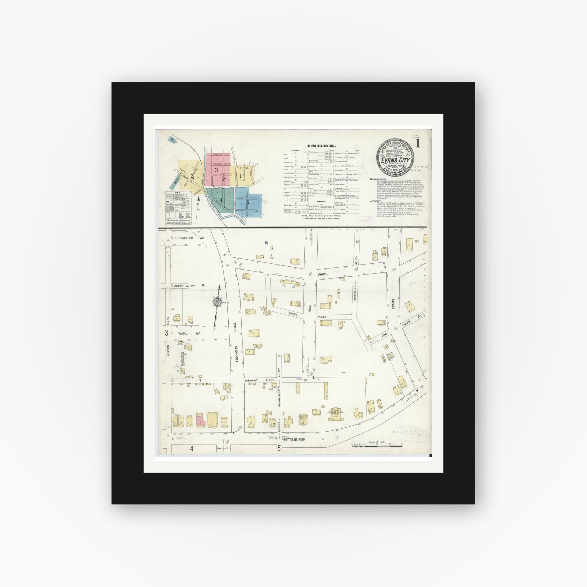 Old map wall art mockup — black gallery frame with white mat — Sanborn Fire Insurance Map from Evans City, Butler County, Pennsylvania (1912), Sheet #0001