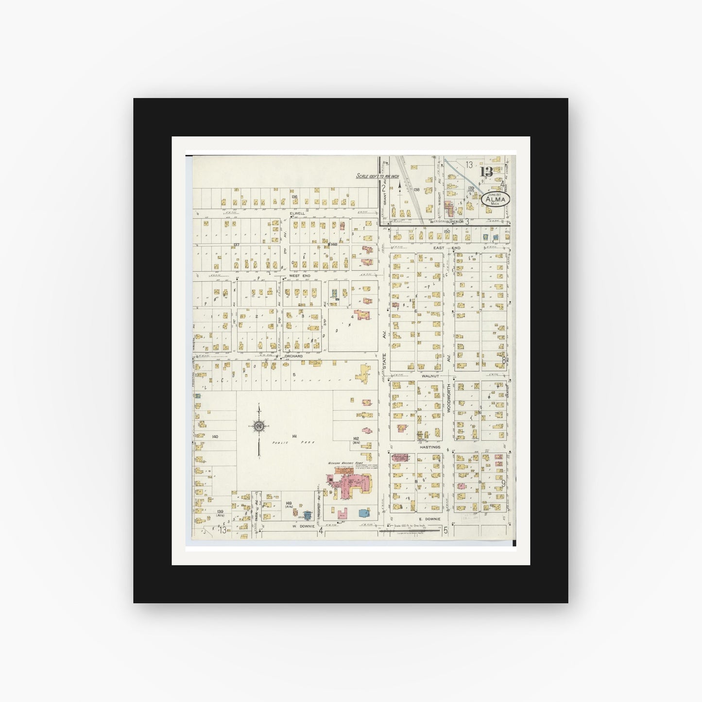 Old map wall art mockup — black gallery frame with white mat — Sanborn Fire Insurance Map from Alma, Gratiot County, Michigan (1917), Sheet #0013
