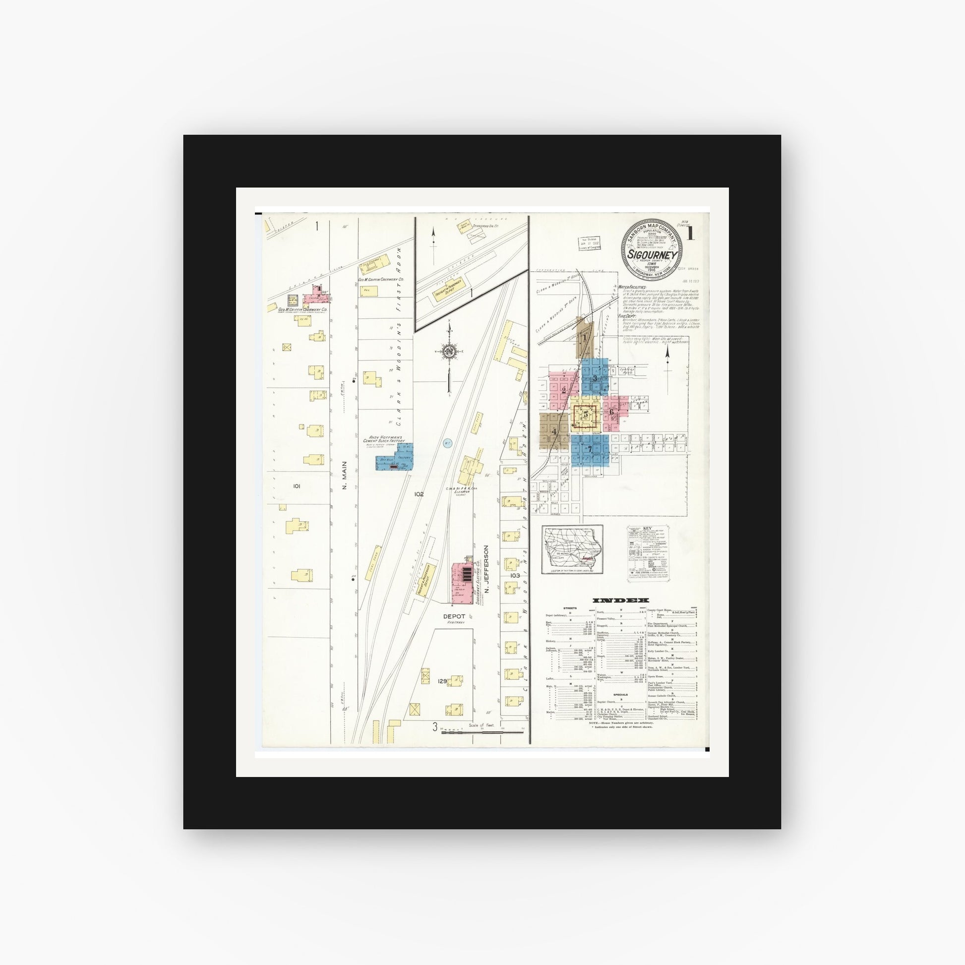 Old map wall art mockup — black gallery frame with white mat — Sanborn Fire Insurance Map from Sigourney, Kiokuk County, Iowa (1916), Sheet #0001