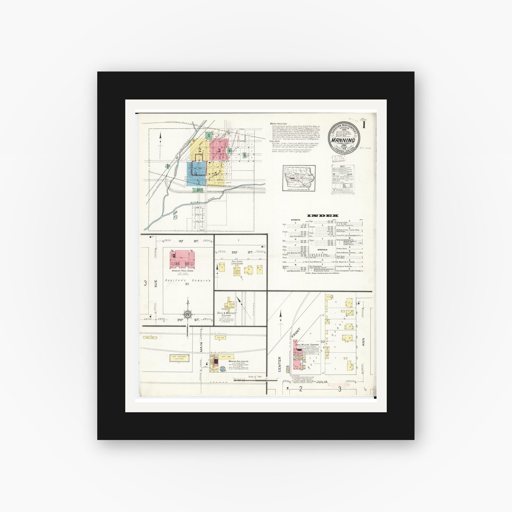 Old map wall art mockup — black gallery frame with white mat — Sanborn Fire Insurance Map from Manning, Carroll County, Iowa (1913) â€” Complete Set