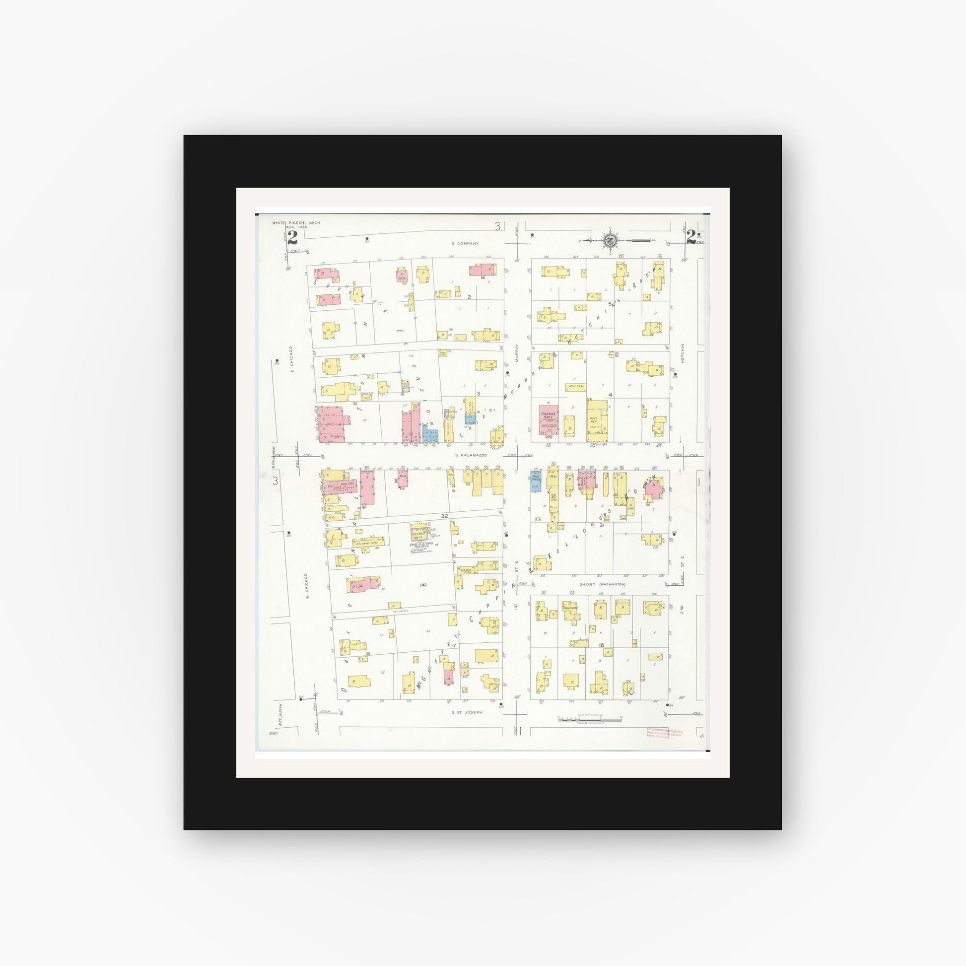 Old map wall art mockup — black gallery frame with white mat — Sanborn Fire Insurance Map from White Pigeon, Saint Joseph County, Michigan (1936), Sheet #0002