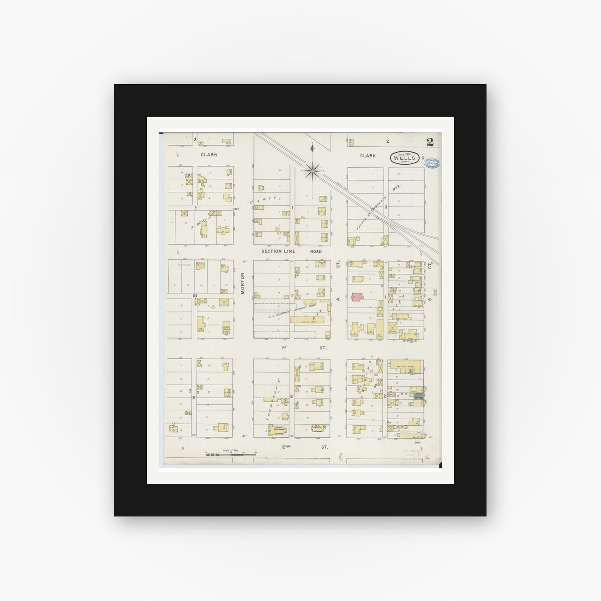 Old map wall art mockup — black gallery frame with white mat — Sanborn Fire Insurance Map from Wells, Faribault County, Minnesota (1894), Sheet #0002