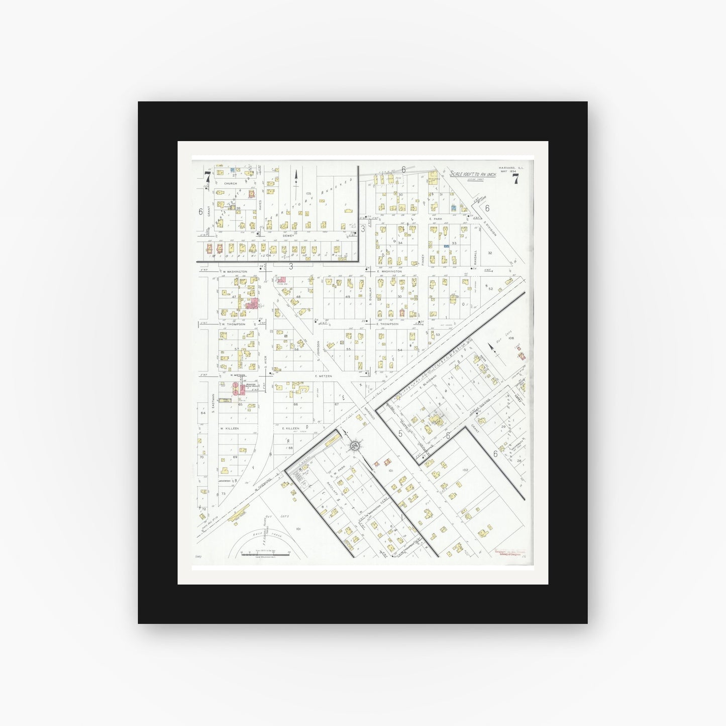 Old map wall art mockup — black gallery frame with white mat — Sanborn Fire Insurance Map from Harvard, McHenry County, Illinois (1934), Sheet #0007