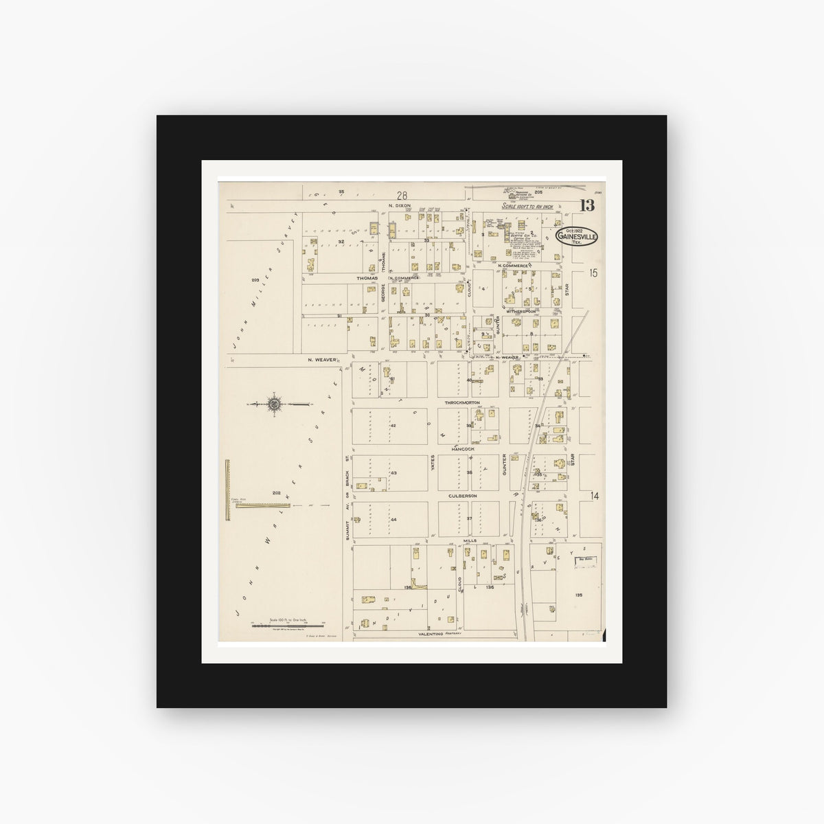 Old map wall art mockup — black gallery frame with white mat — Sanborn Fire Insurance Map from Gainesville, Cooke County, Texas (1922), Sheet #0013