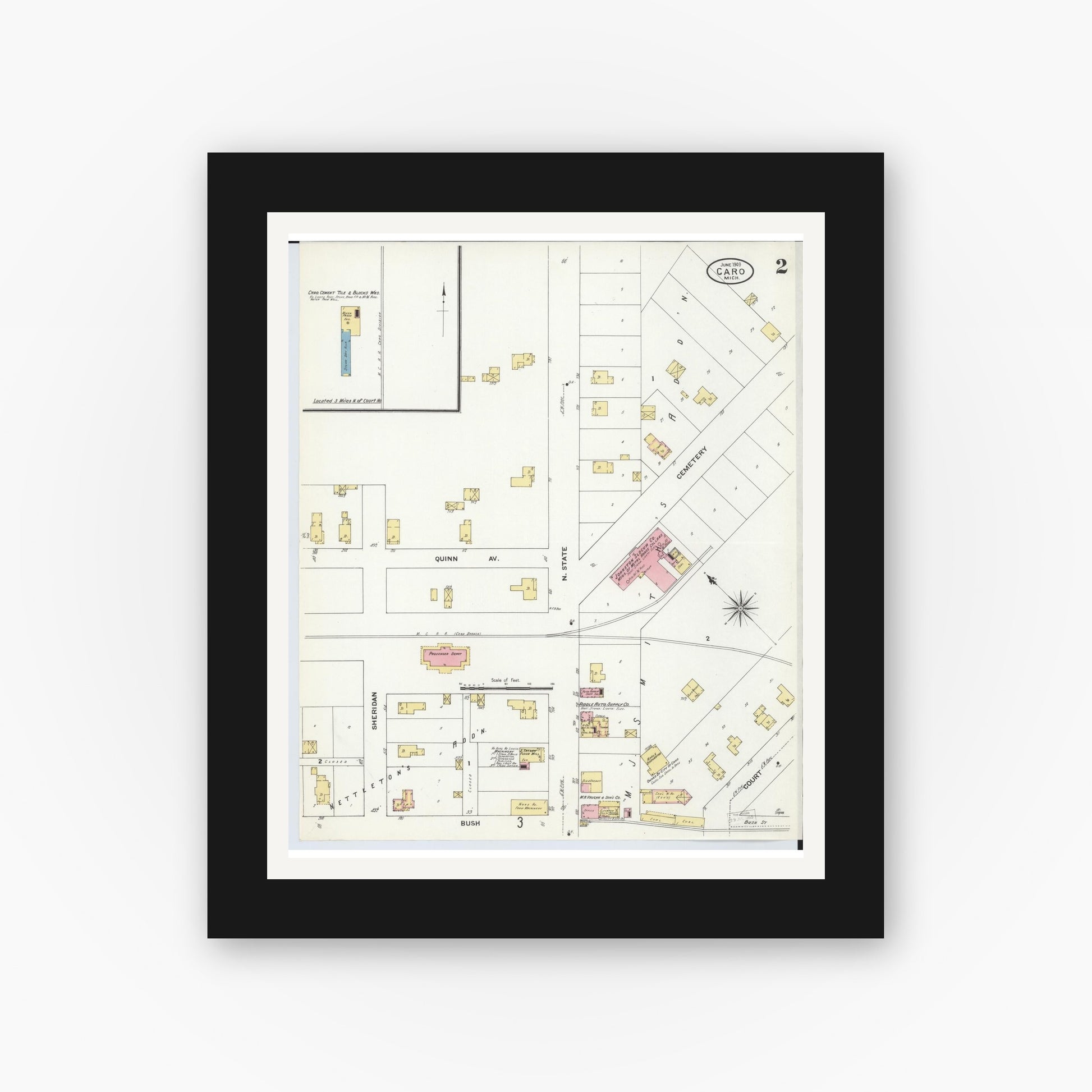 Old map wall art mockup — black gallery frame with white mat — Sanborn Fire Insurance Map from Caro, Tuscola County, Michigan (1909), Sheet #0002