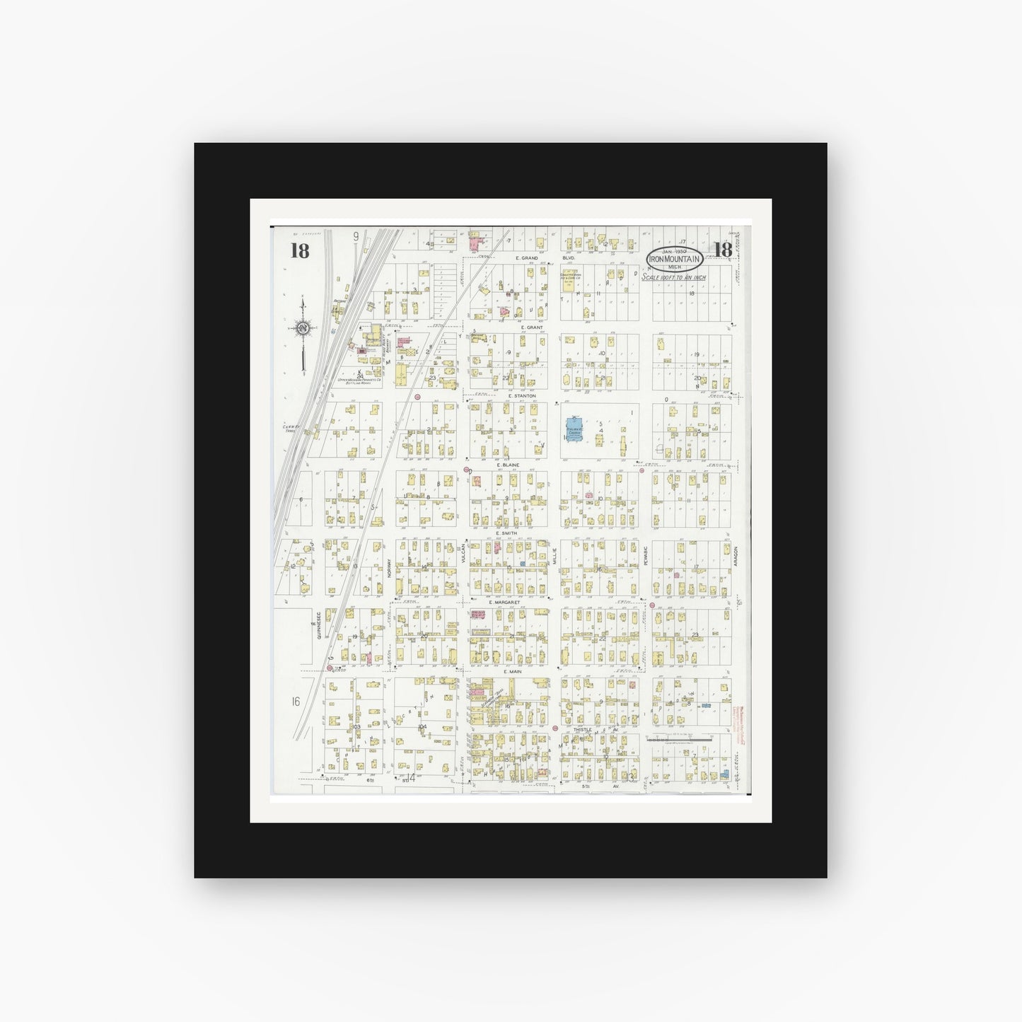 Old map wall art mockup — black gallery frame with white mat — Sanborn Fire Insurance Map from Iron Mountain, Dickinson County, Michigan (1930), Sheet #0018