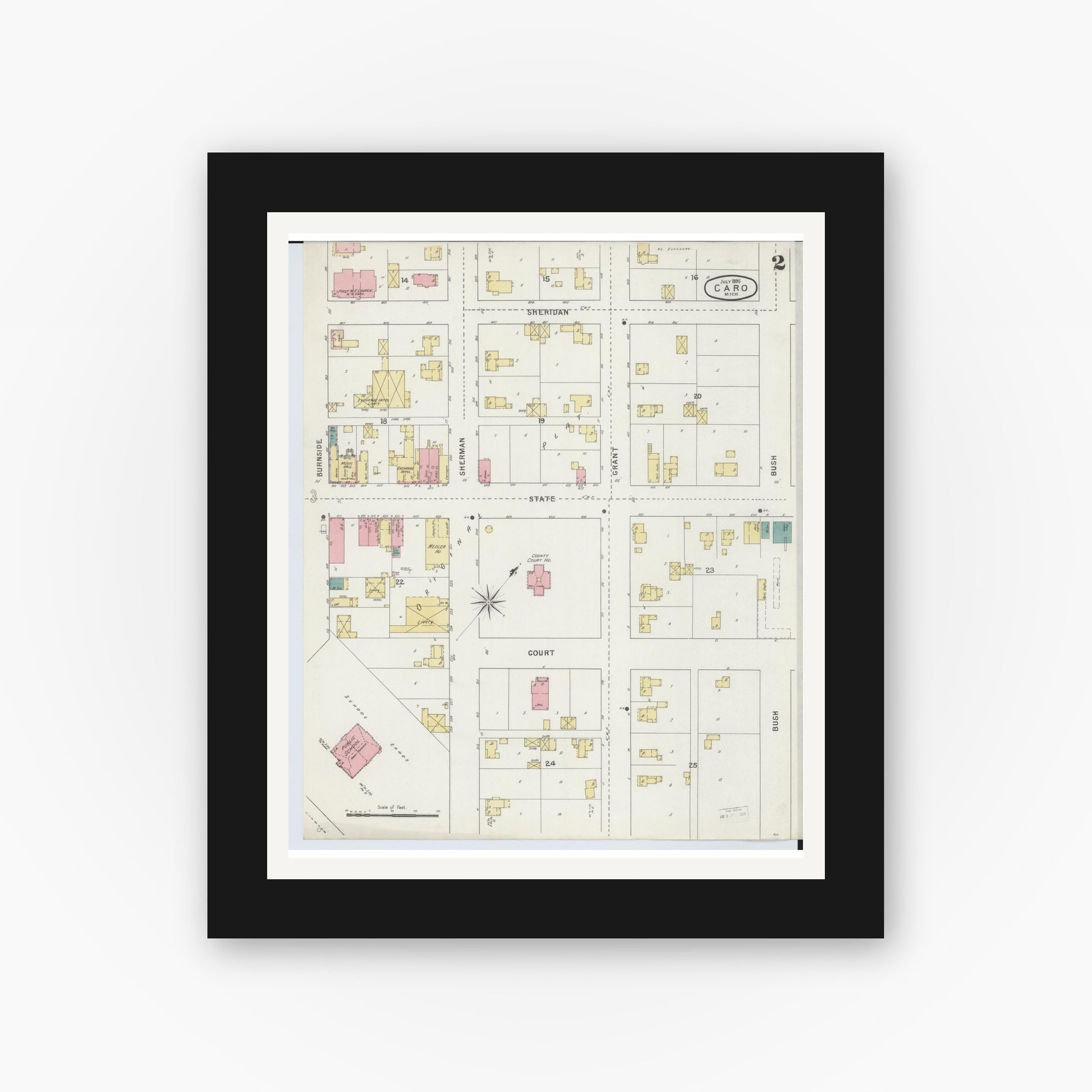 Old map wall art mockup — black gallery frame with white mat — Sanborn Fire Insurance Map from Caro, Tuscola County, Michigan (1895), Sheet #0002