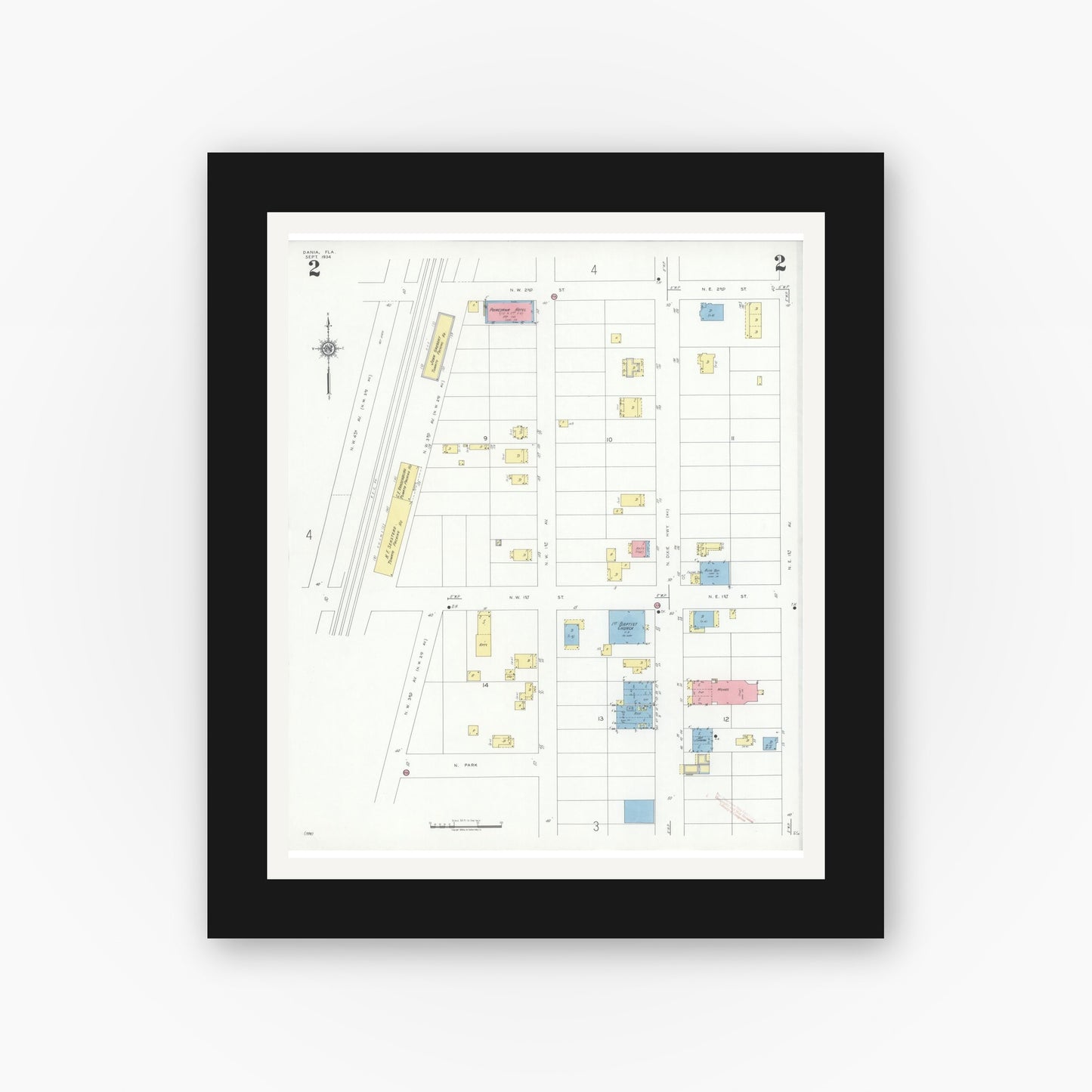 Old map wall art mockup — black gallery frame with white mat — Sanborn Fire Insurance Map from Dania, Broward County, Florida (1934), Sheet #0002