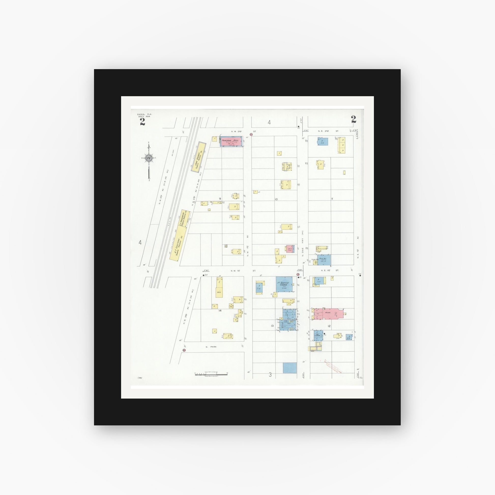 Old map wall art mockup — black gallery frame with white mat — Sanborn Fire Insurance Map from Dania, Broward County, Florida (1934), Sheet #0002