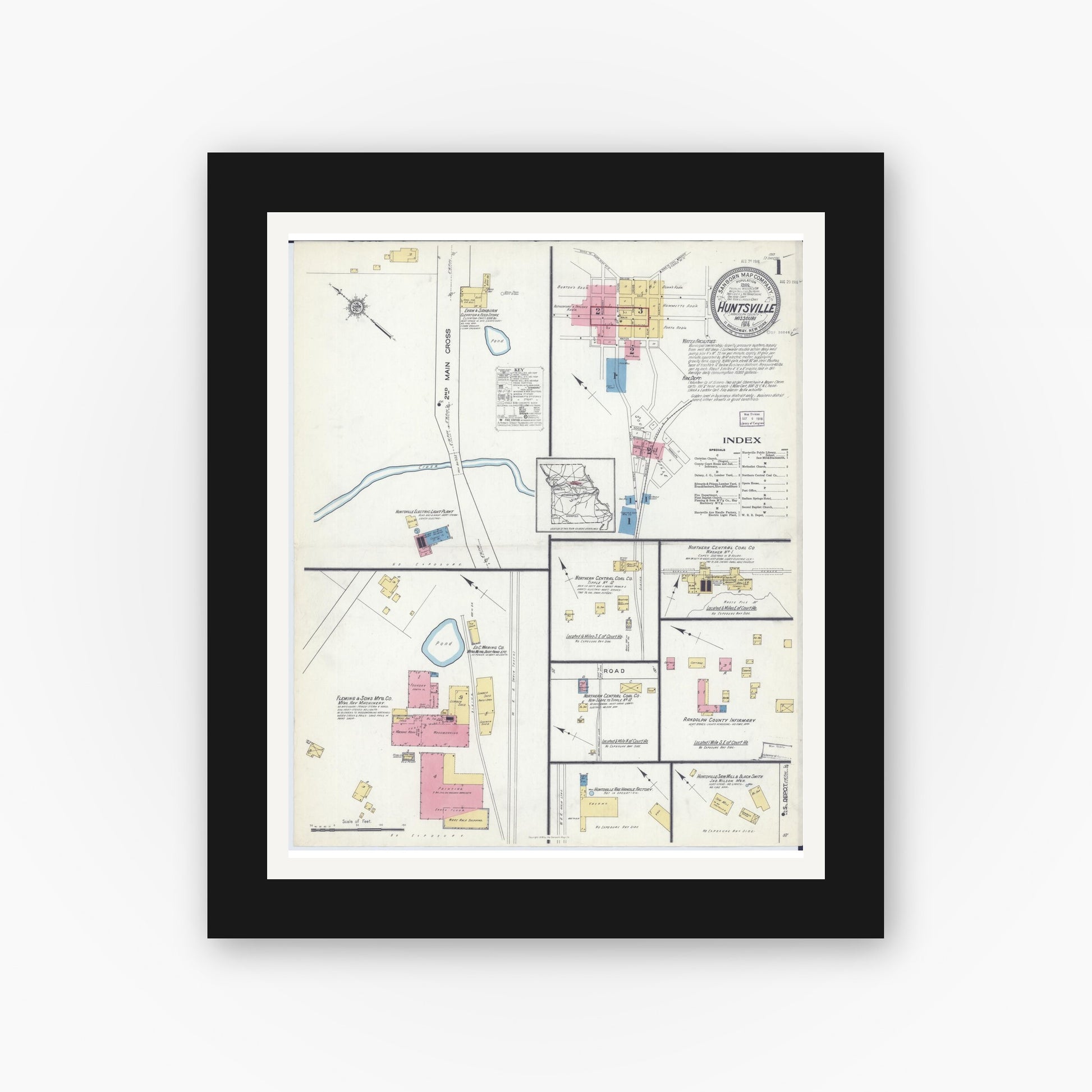 Old map wall art mockup — black gallery frame with white mat — Sanborn Fire Insurance Map from Huntsville, Randolph County, Missouri (1916), Sheet #0001