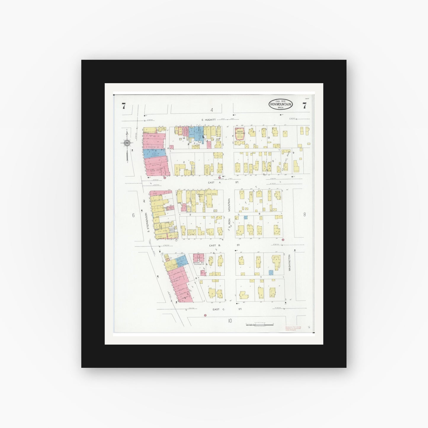 Old map wall art mockup — black gallery frame with white mat — Sanborn Fire Insurance Map from Iron Mountain, Dickinson County, Michigan (1930), Sheet #0007
