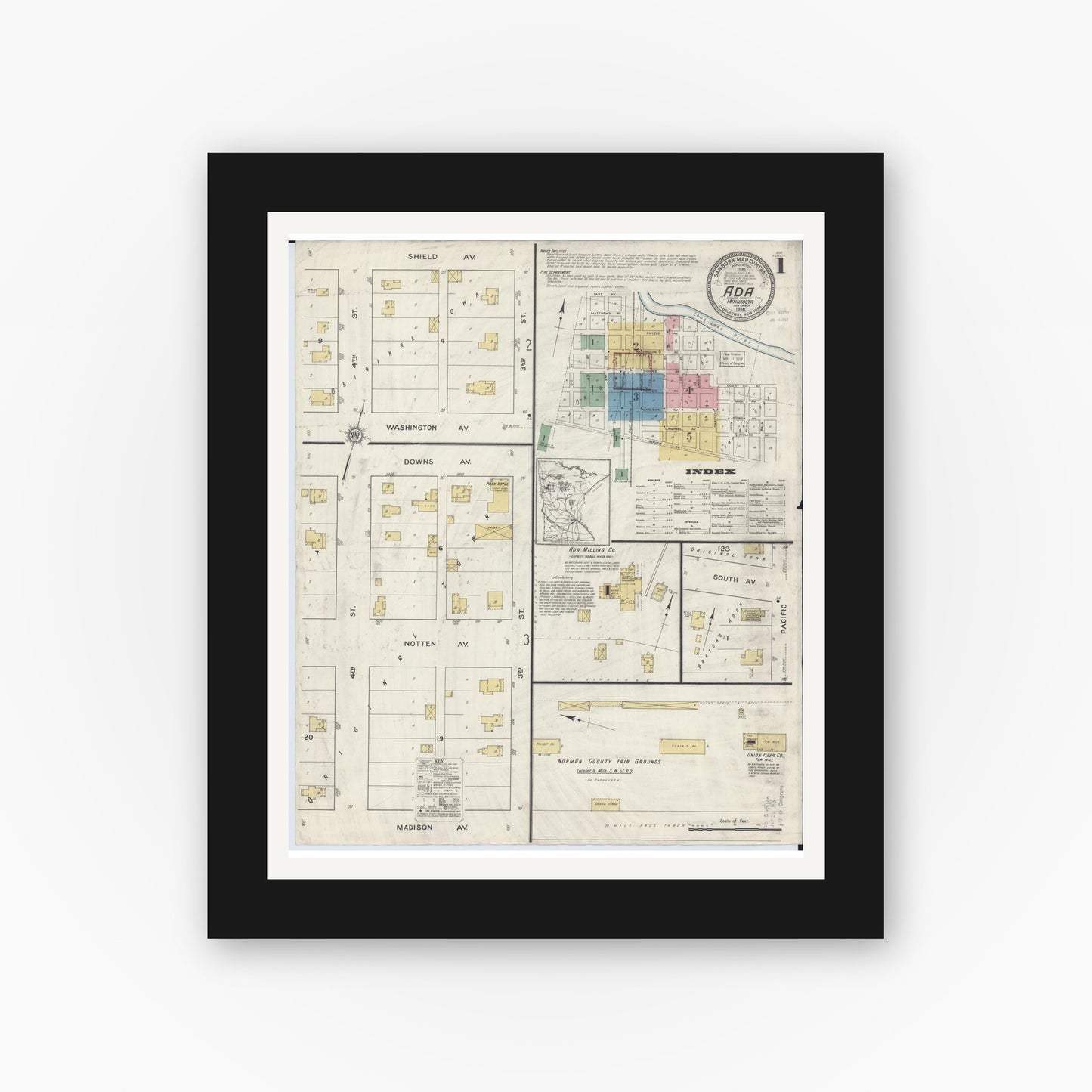 Old map wall art mockup — black gallery frame with white mat — Sanborn Fire Insurance Map from Ada, Norman County, Minnesota (1916), Sheet #0001