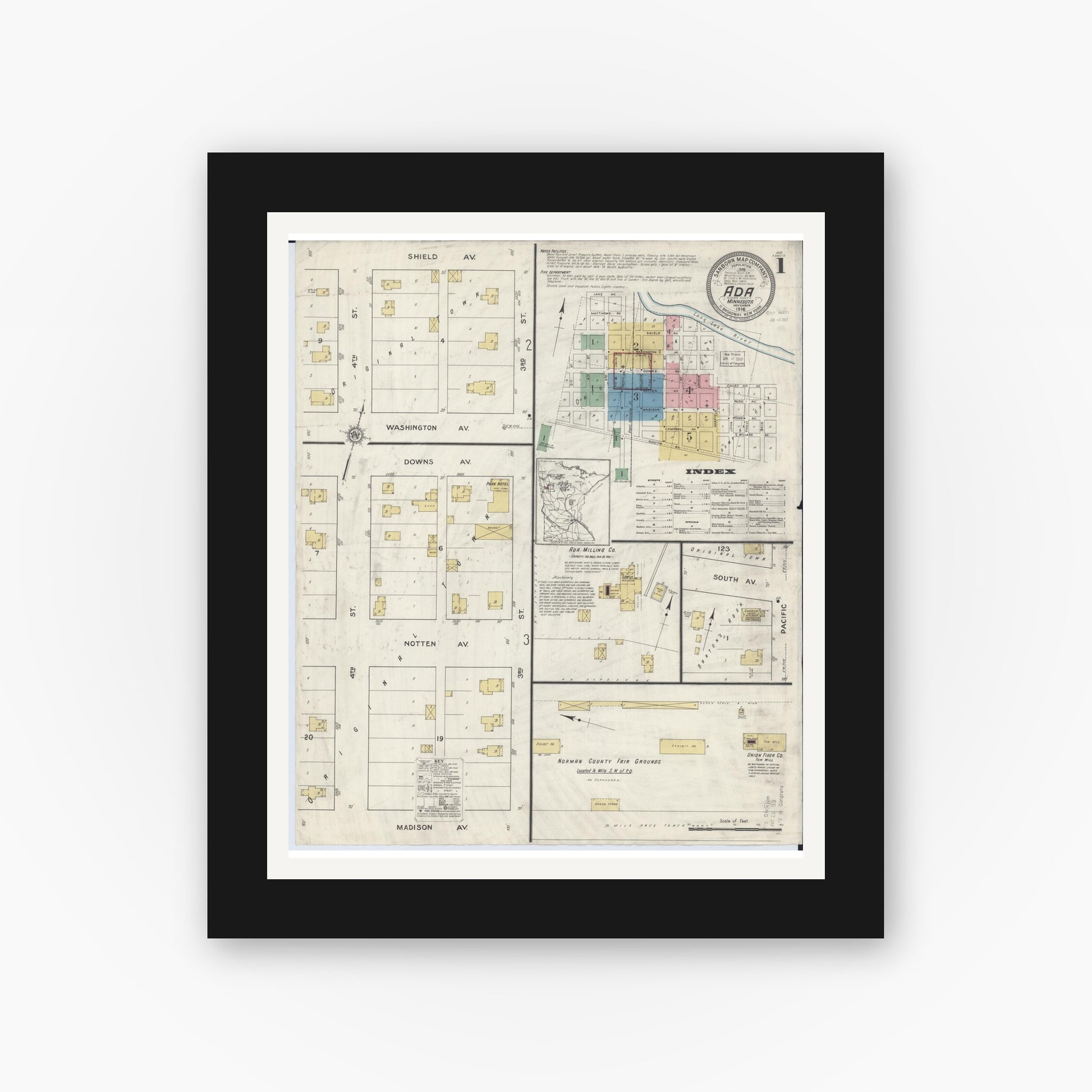 Old map wall art mockup — black gallery frame with white mat — Sanborn Fire Insurance Map from Ada, Norman County, Minnesota (1916), Sheet #0001