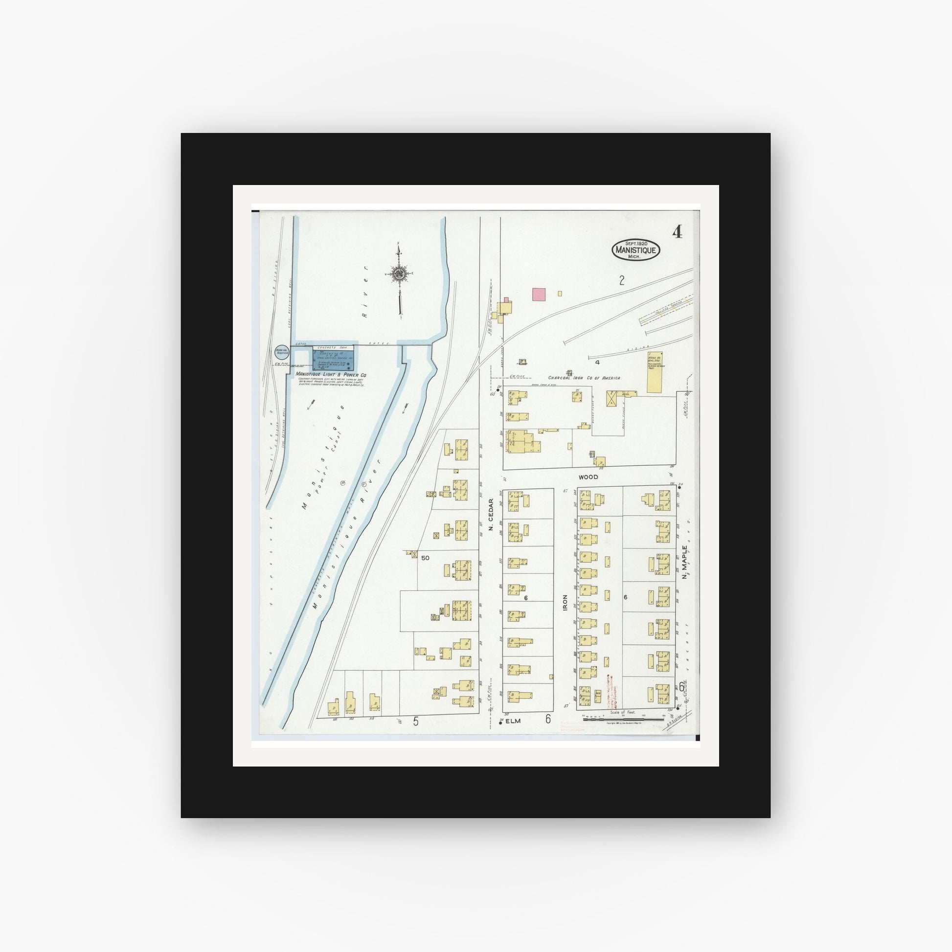 Old map wall art mockup — black gallery frame with white mat — Sanborn Fire Insurance Map from Manistique, Schoolcraft County, Michigan (1920), Sheet #0004