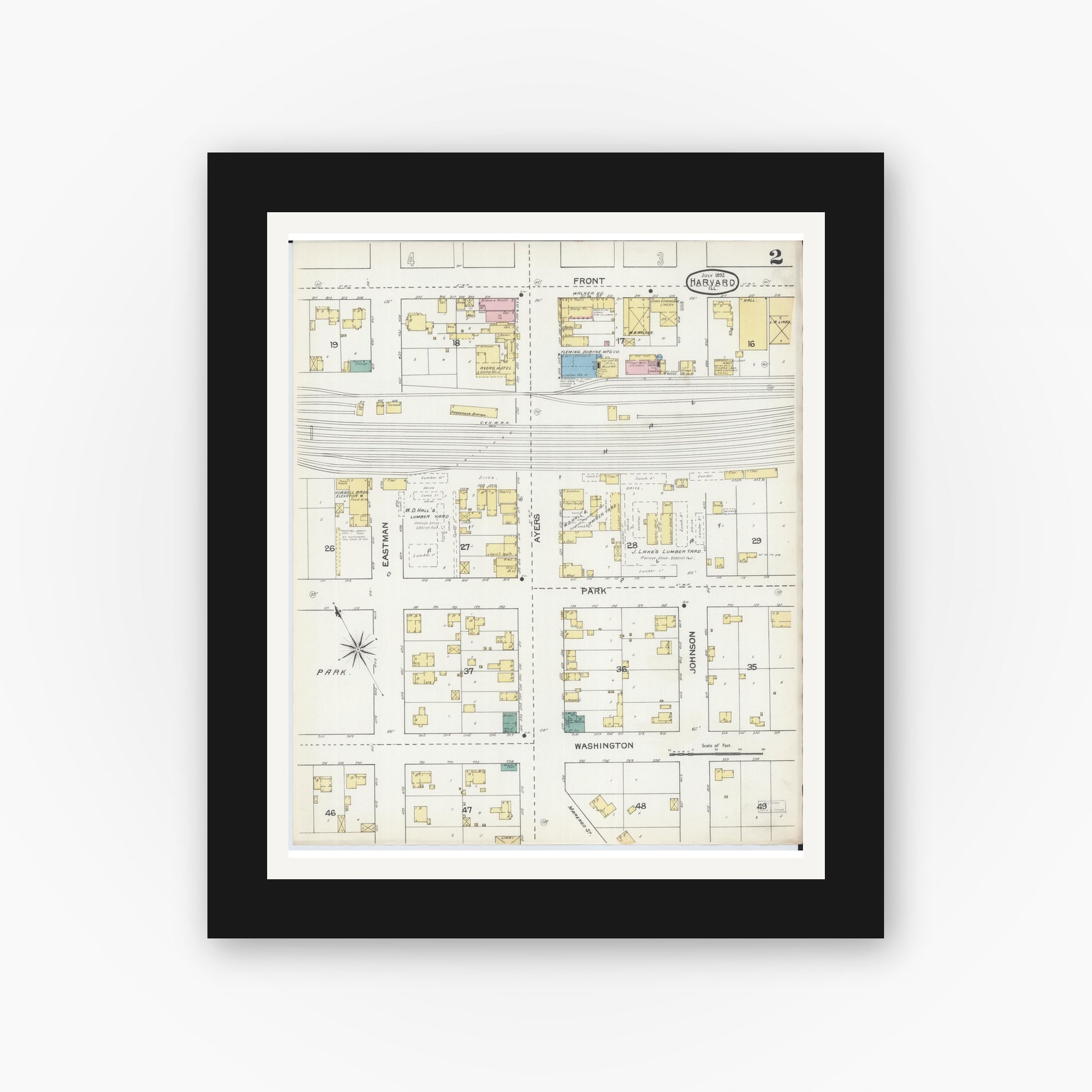 Old map wall art mockup — black gallery frame with white mat — Sanborn Fire Insurance Map from Harvard, McHenry County, Illinois (1892), Sheet #0002