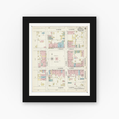Old map wall art mockup — black gallery frame with white mat — Sanborn Fire Insurance Map from Nevada, Vernon County, Missouri (1890), Sheet #0002
