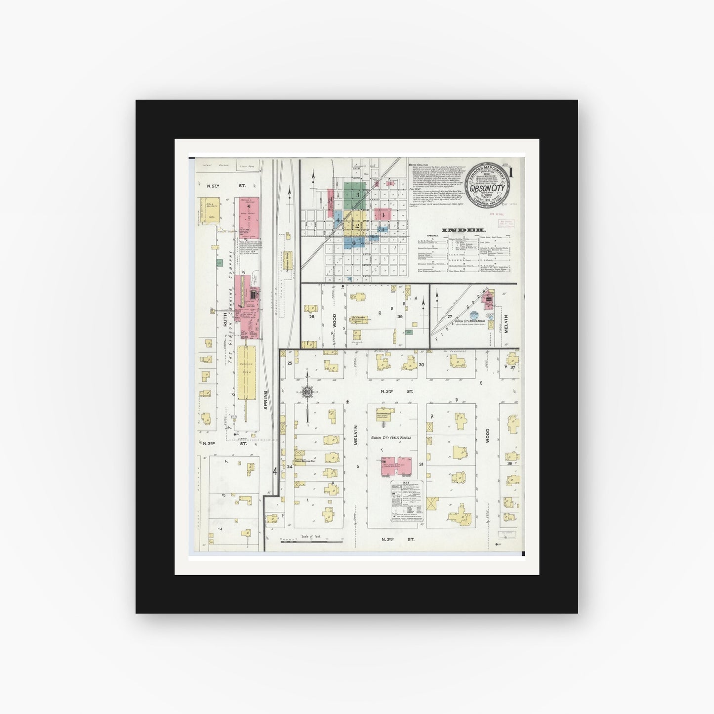 Old map wall art mockup — black gallery frame with white mat — Sanborn Fire Insurance Map from Gibson City, Ford County, Illinois (1910), Sheet #0001