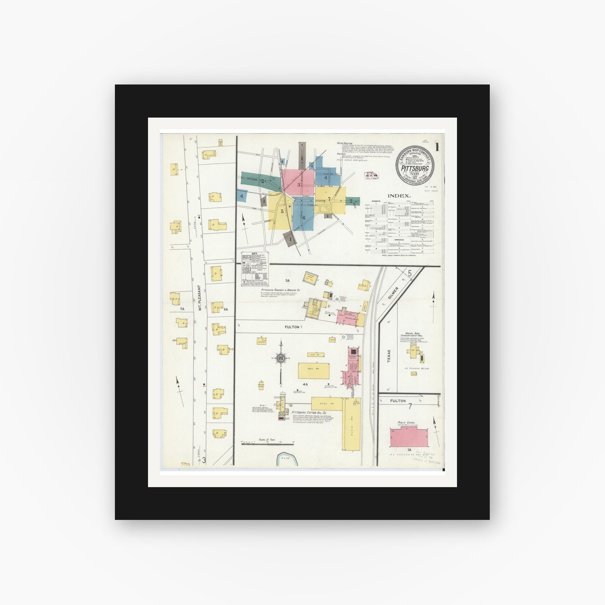 Old map wall art mockup — black gallery frame with white mat — Sanborn Fire Insurance Map from Pittsburg, Camp County, Texas (1911), Sheet #0001