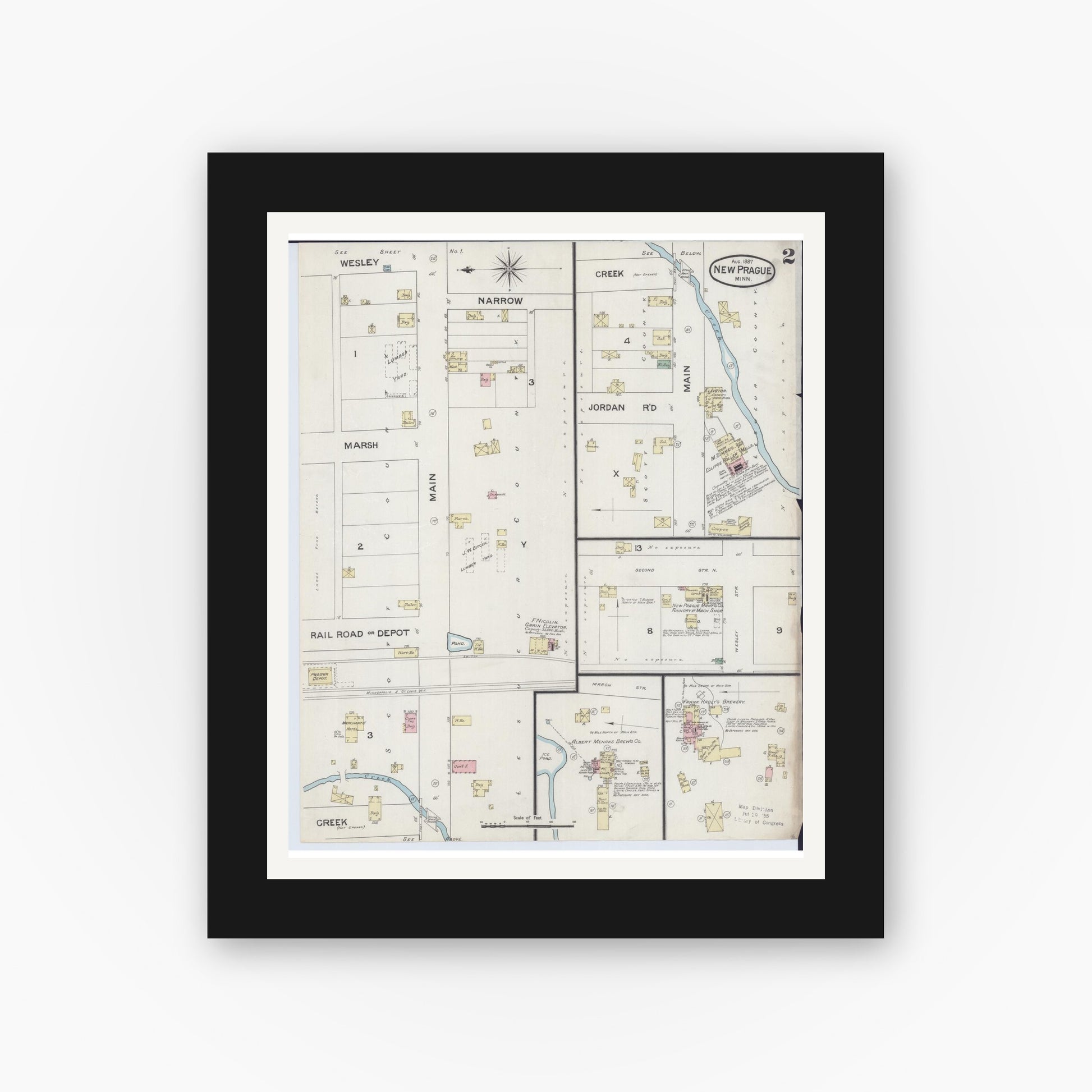 Old map wall art mockup — black gallery frame with white mat — Sanborn Fire Insurance Map from New Prague, Scott And Le Sueur, Minnesota (1887), Sheet #0002