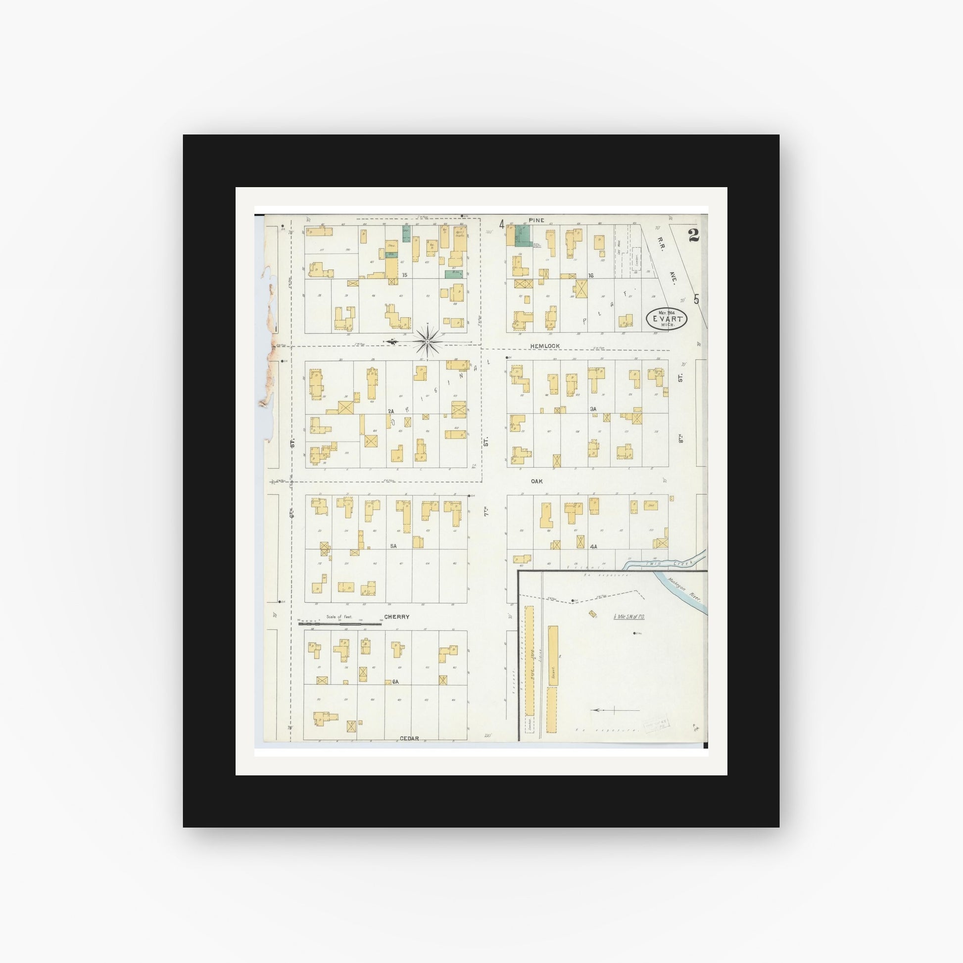 Old map wall art mockup — black gallery frame with white mat — Sanborn Fire Insurance Map from Evart, Osceola County, Michigan (1904), Sheet #0002