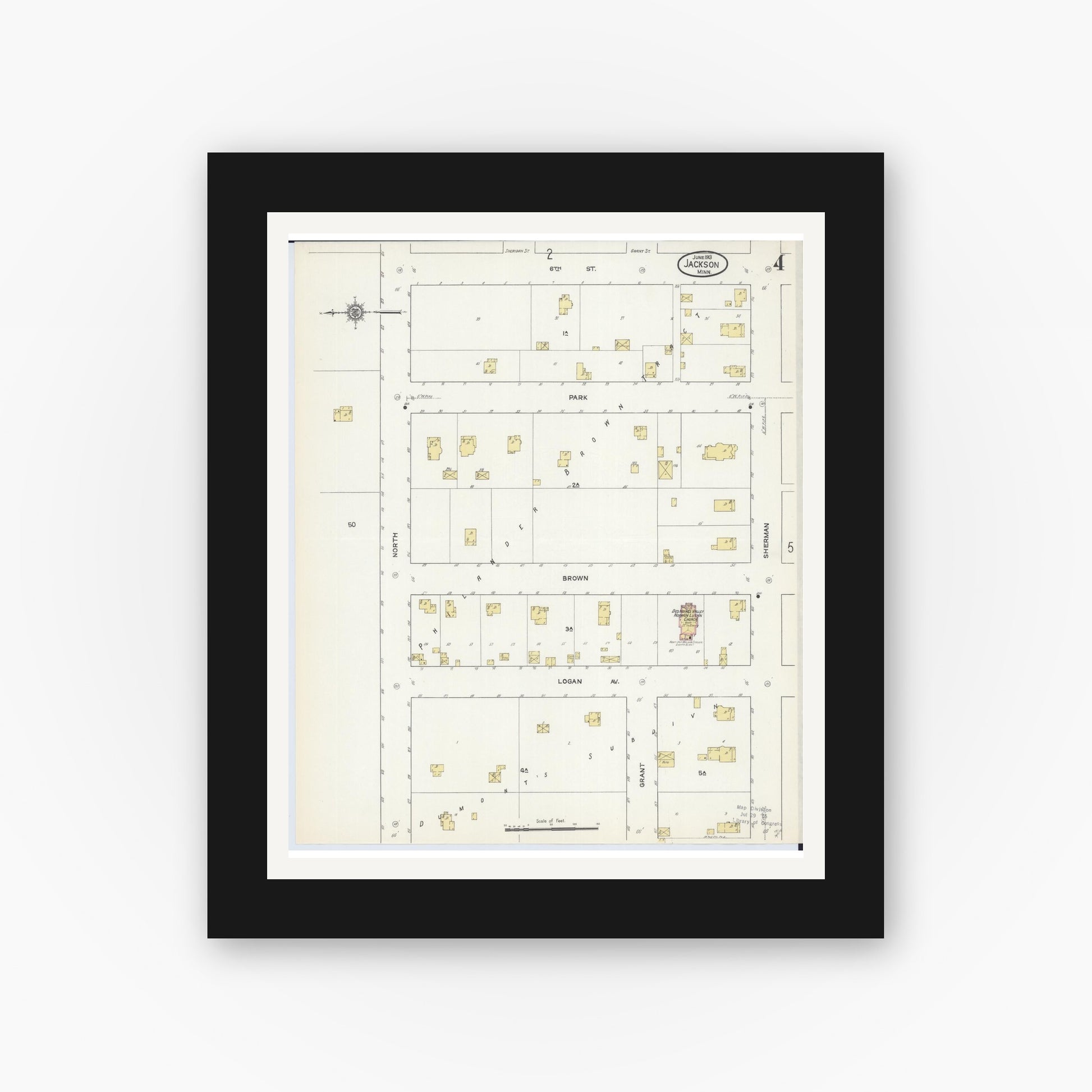 Old map wall art mockup — black gallery frame with white mat — Sanborn Fire Insurance Map from Jackson, Jackson County, Minnesota (1913), Sheet #0004