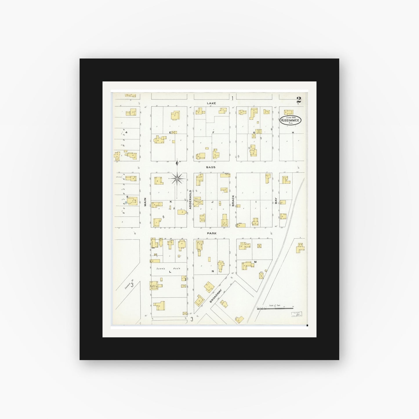 Old map wall art mockup — black gallery frame with white mat — Sanborn Fire Insurance Map from Kissimmee, Osceola County, Florida (1909), Sheet #0002