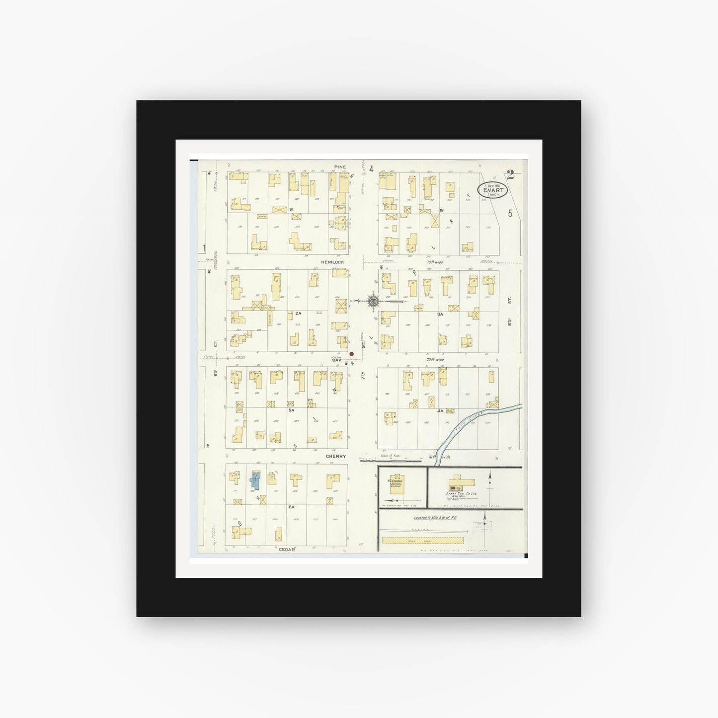 Old map wall art mockup — black gallery frame with white mat — Sanborn Fire Insurance Map from Evart, Osceola County, Michigan (1910), Sheet #0002