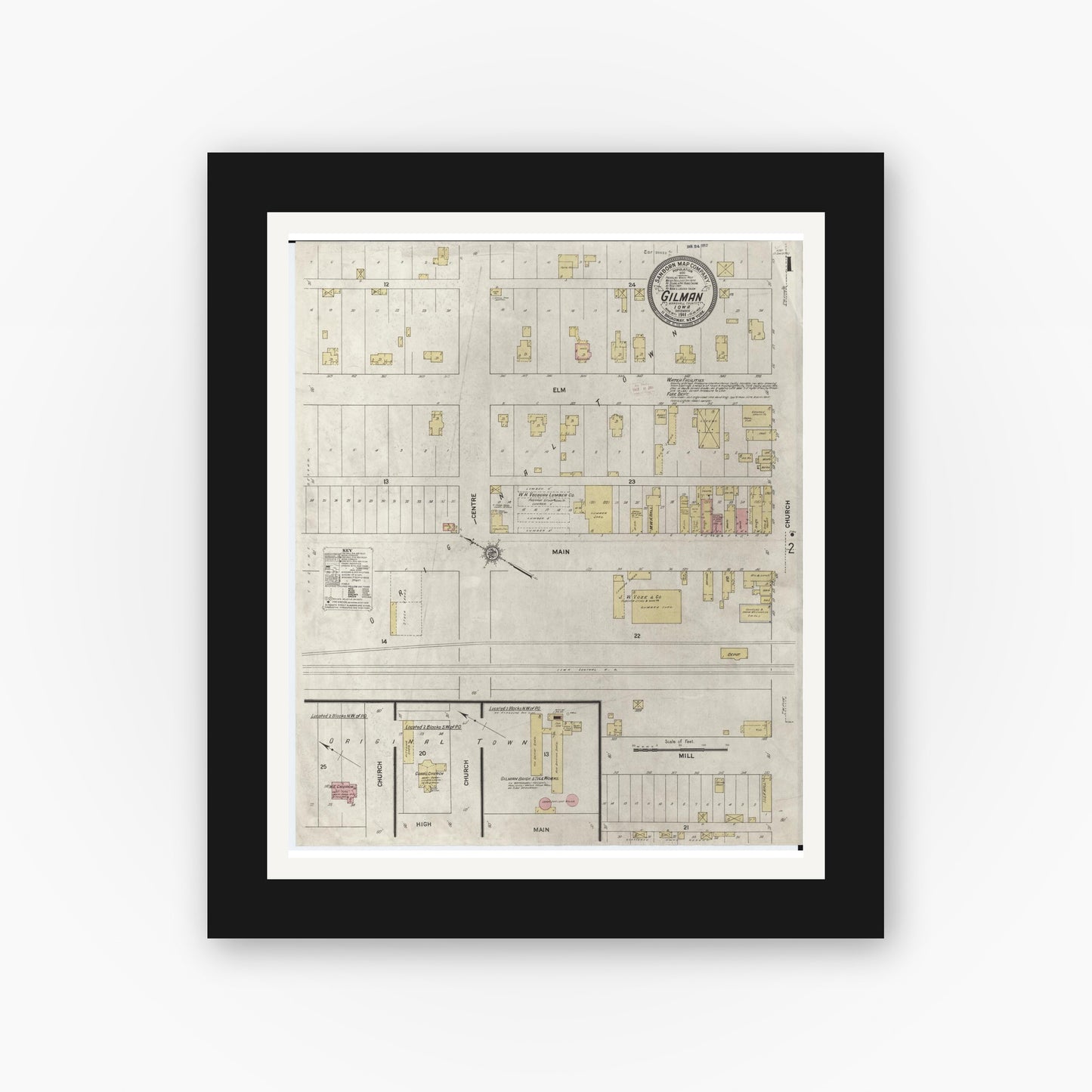 Old map wall art mockup — black gallery frame with white mat — Sanborn Fire Insurance Map from Gilman, Marshall County, Iowa (1911) â€” Complete Set