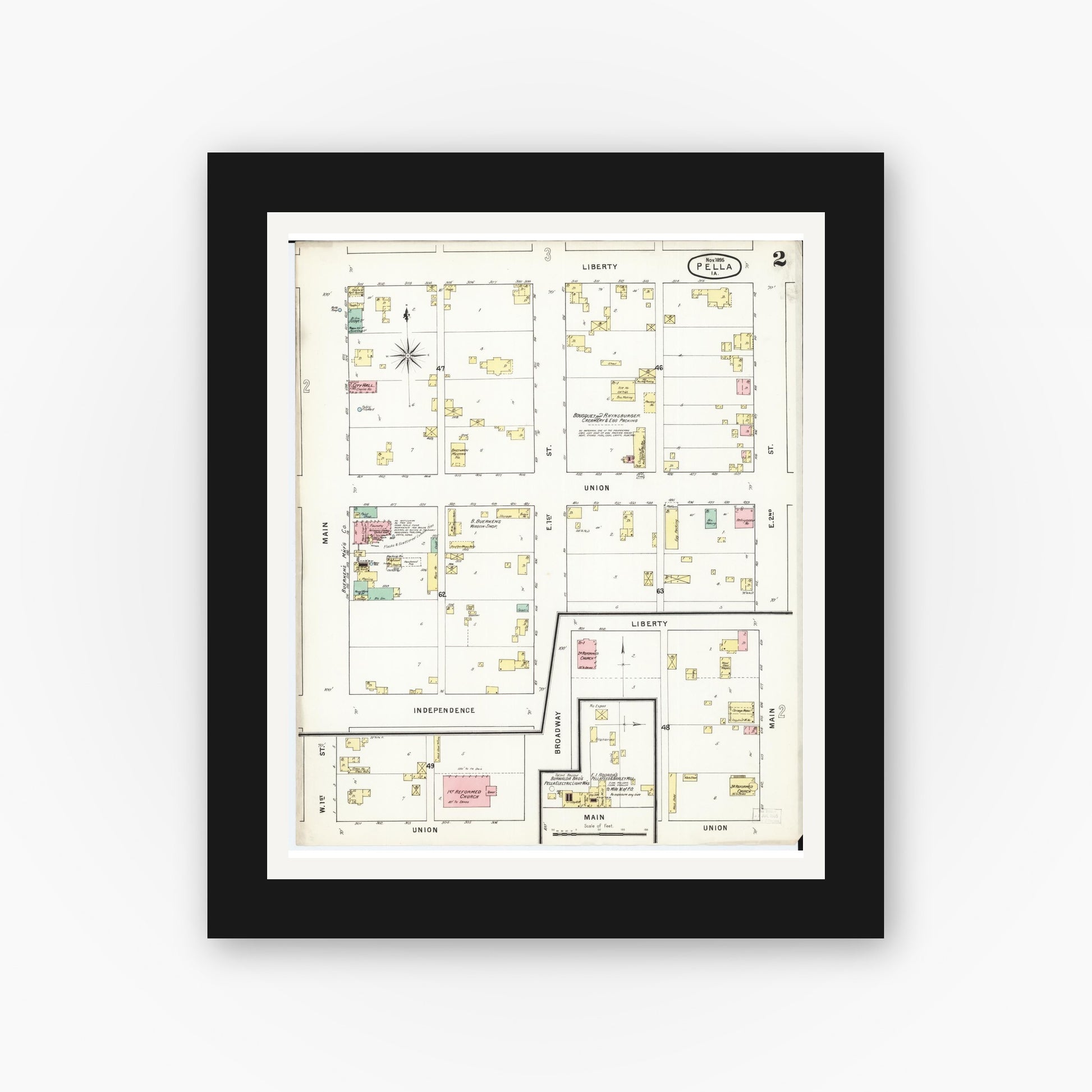 Old map wall art mockup — black gallery frame with white mat — Sanborn Fire Insurance Map from Pella, Marion County, Iowa (1895), Sheet #0002