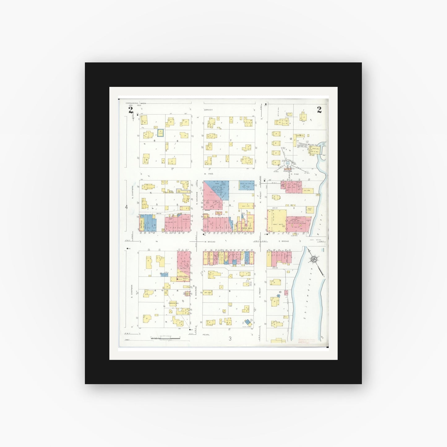 Old map wall art mockup — black gallery frame with white mat — Sanborn Fire Insurance Map from Chesaning, Saginaw County, Michigan (1935), Sheet #0002