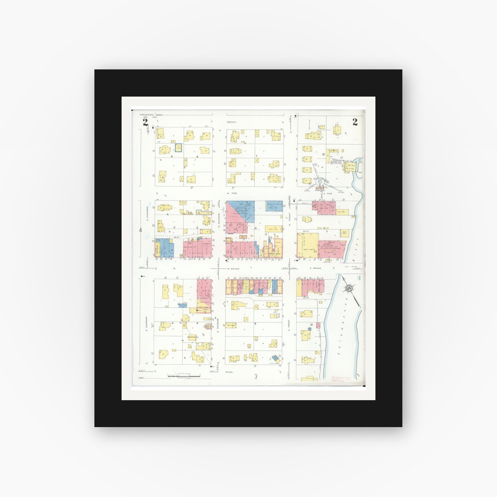 Old map wall art mockup — black gallery frame with white mat — Sanborn Fire Insurance Map from Chesaning, Saginaw County, Michigan (1935), Sheet #0002
