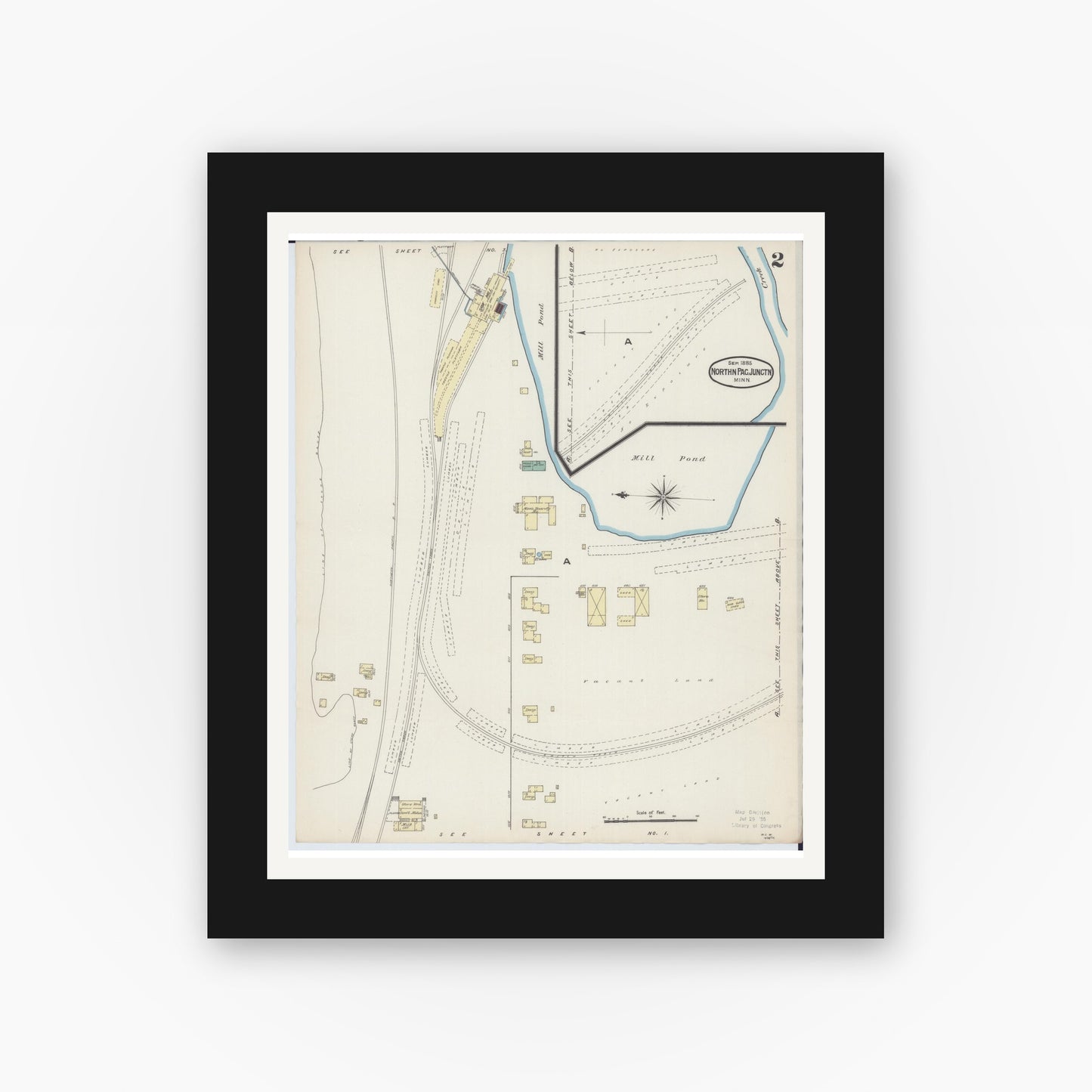 Old map wall art mockup — black gallery frame with white mat — Sanborn Fire Insurance Map from Northern Pacific Junction, Carlton County, Minnesota (1885), Sheet #0002