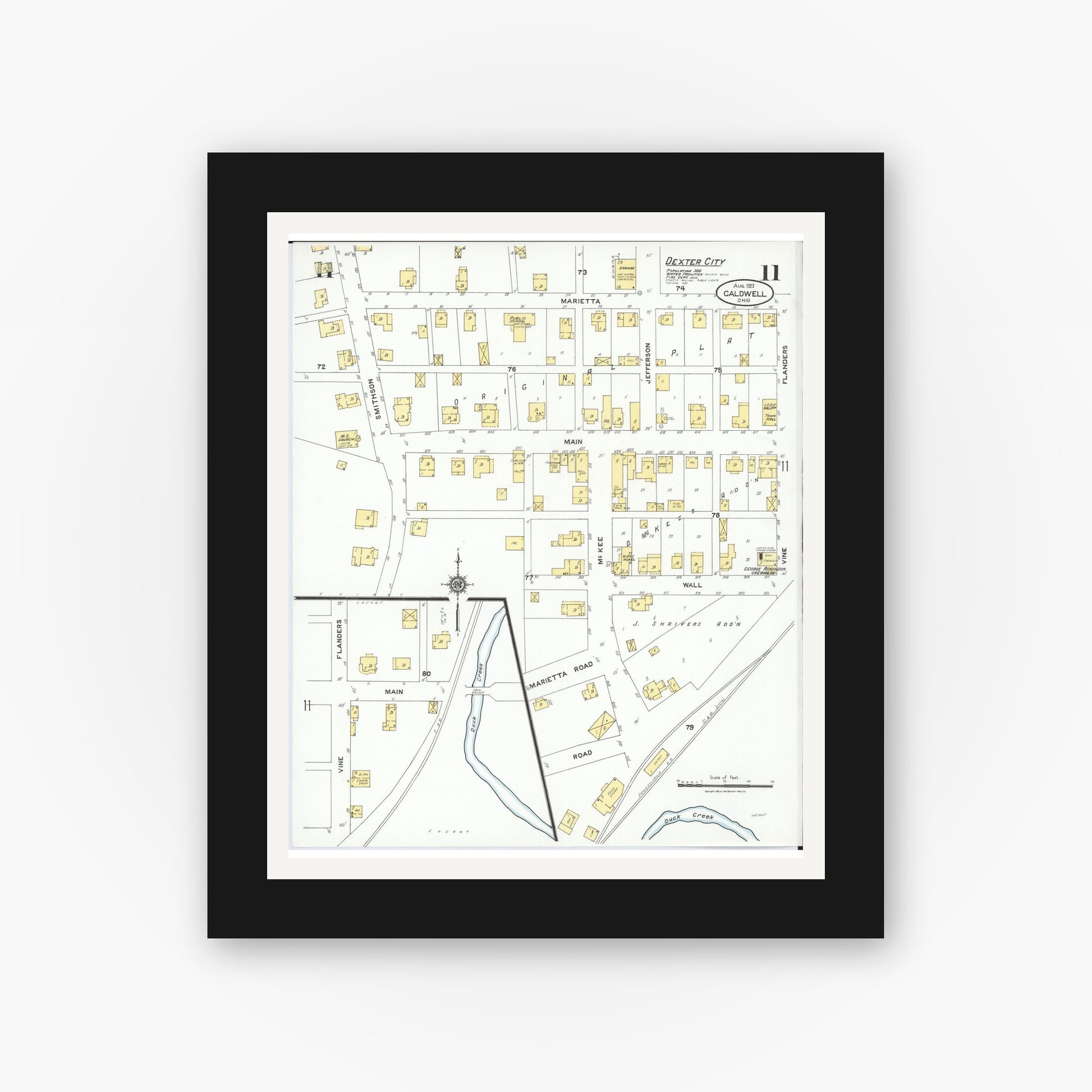 Old map wall art mockup — black gallery frame with white mat — Sanborn Fire Insurance Map from Caldwell, Noble County, Ohio (1923), Sheet #0011