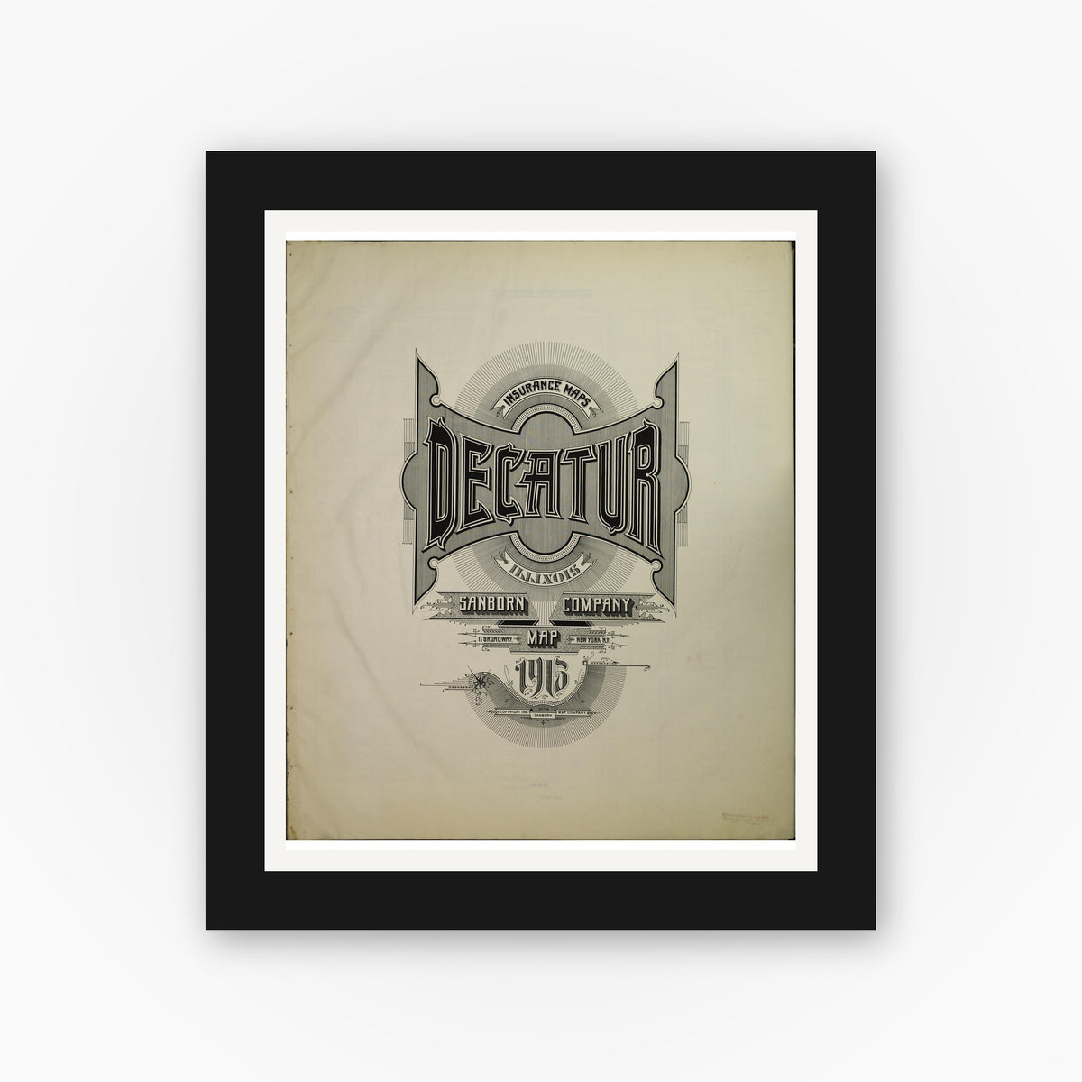 Old map wall art mockup — black gallery frame with white mat — Sanborn Fire Insurance Map from Decatur, Macon County, Illinois (1916), Sheet #0001