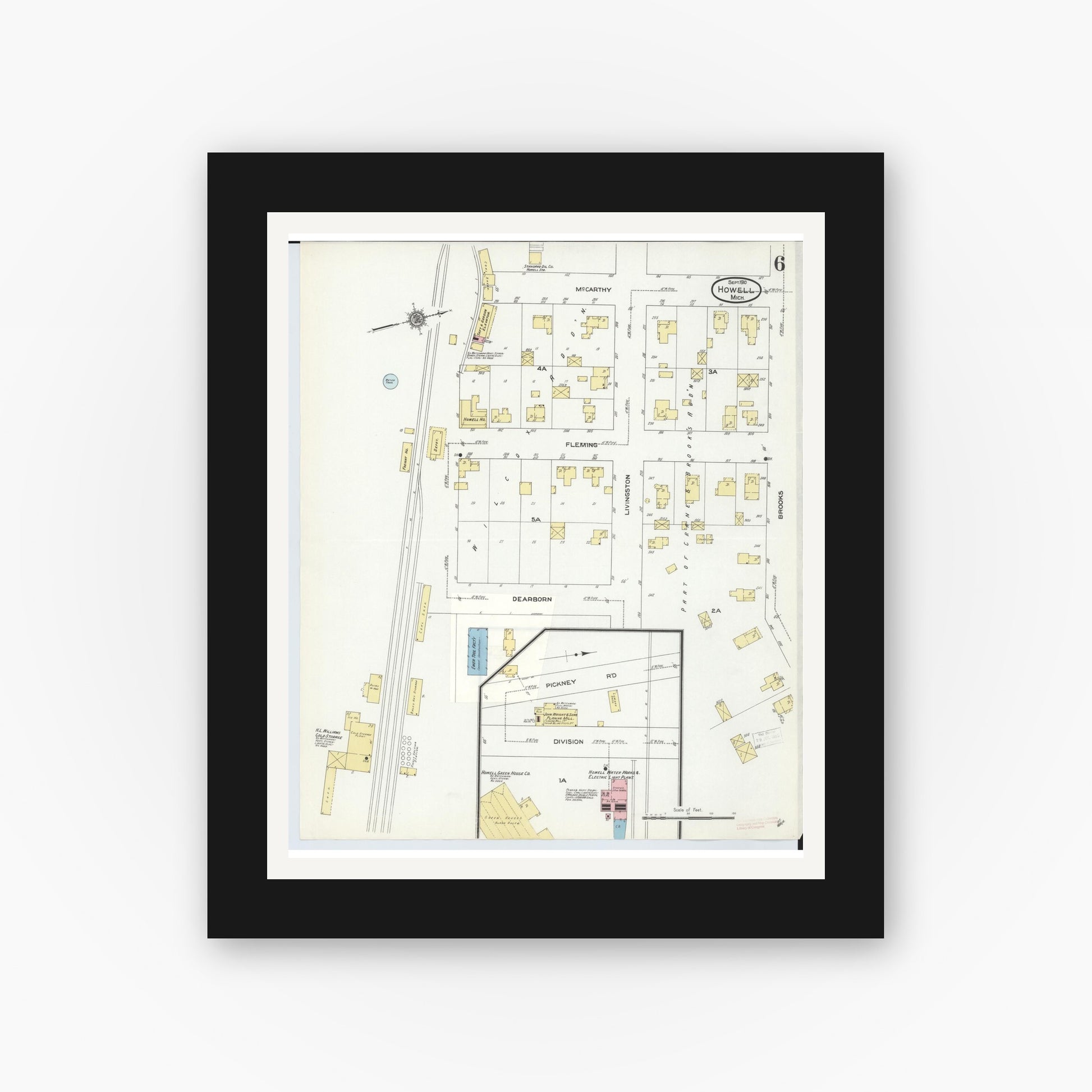 Old map wall art mockup — black gallery frame with white mat — Sanborn Fire Insurance Map from Howell, Livingston County, Michigan (1910), Sheet #0006