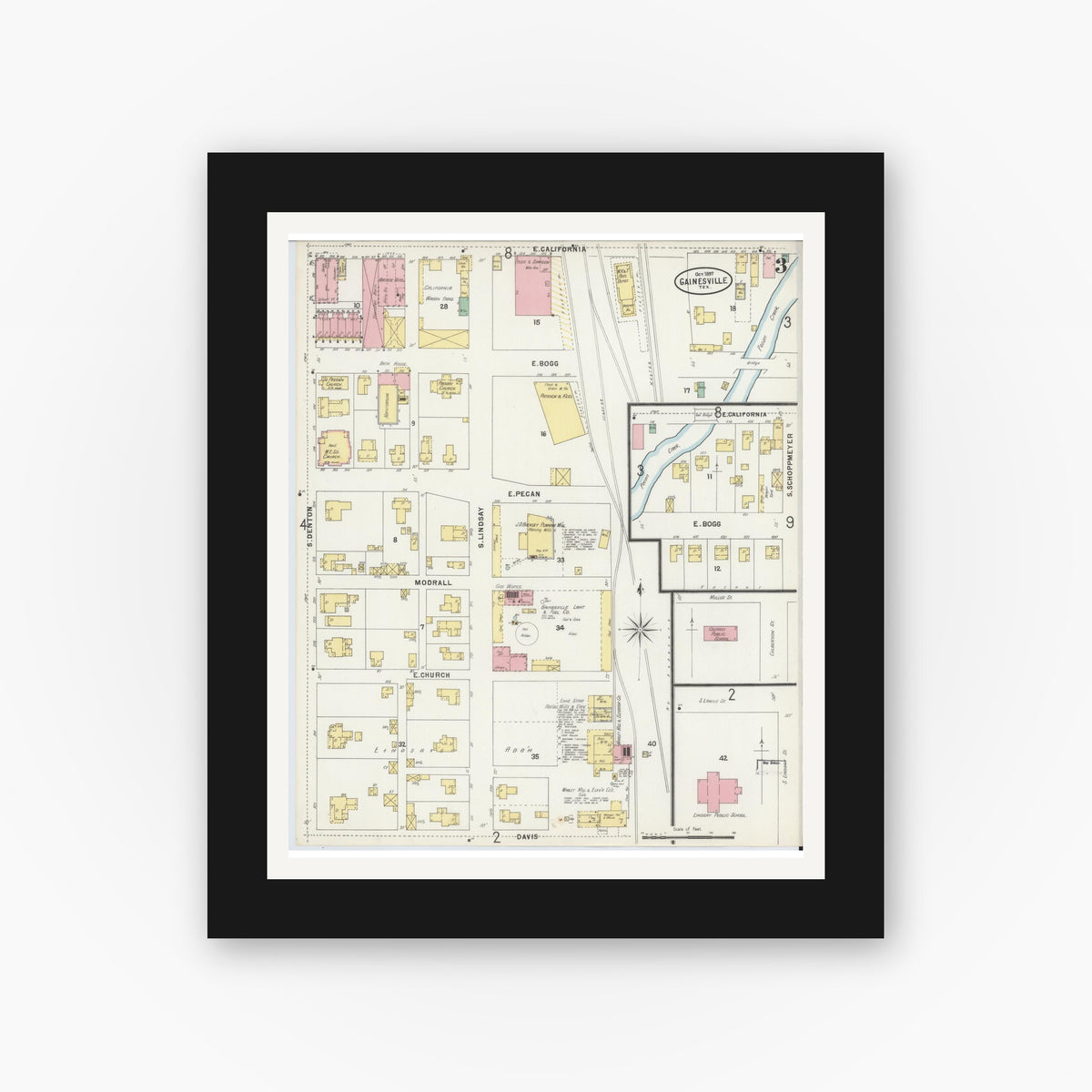 Old map wall art mockup — black gallery frame with white mat — Sanborn Fire Insurance Map from Gainesville, Cooke County, Texas (1897), Sheet #0003